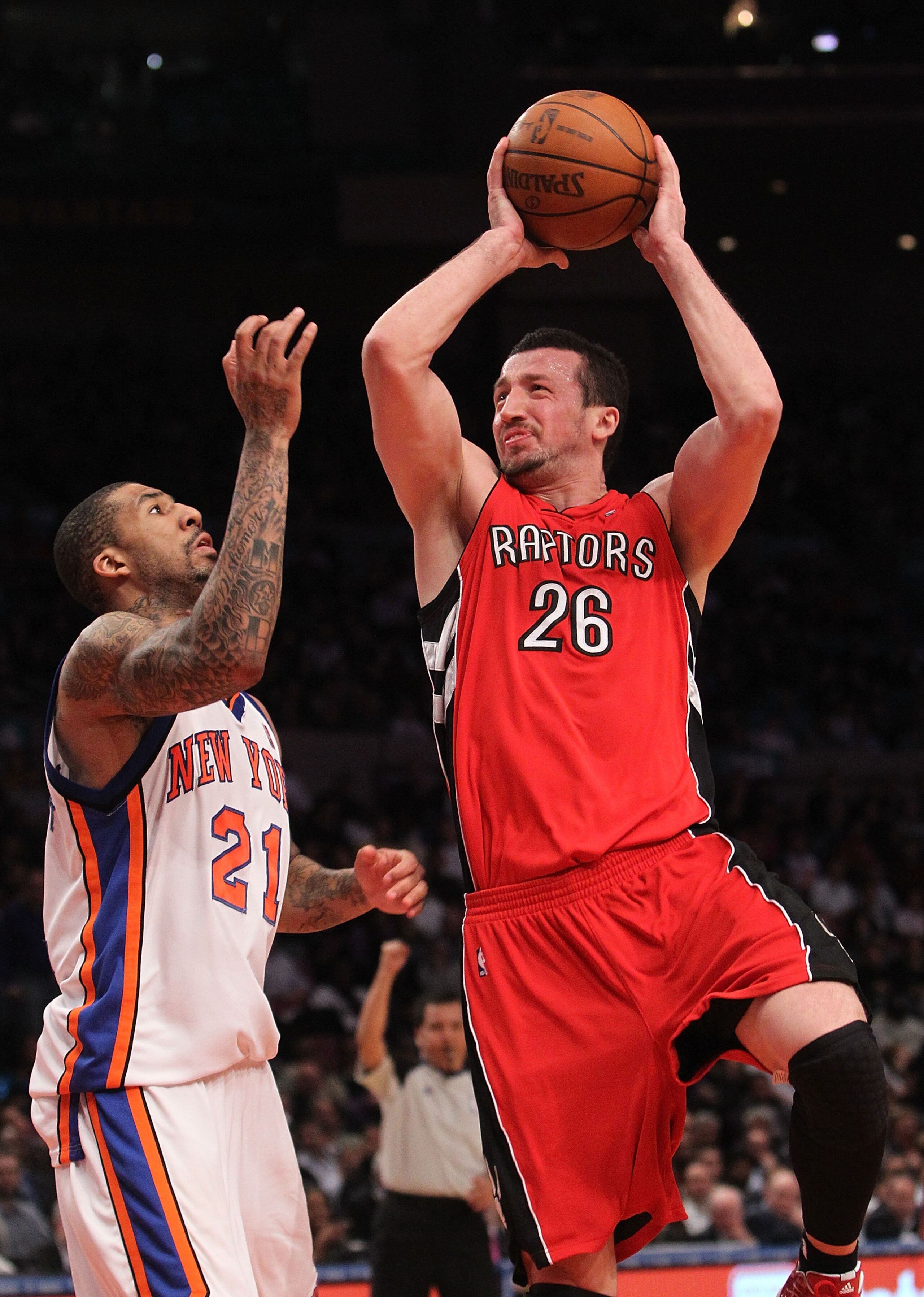 NEW YORK - JANUARY 28:  Hedo Turkoglu #26 of the Toronto Raptors shoots the ball over Wilson Chandler #21 of the New York Knicks at Madison Square Garden on January 28, 2010 in New York, New York. NOTE TO USER: User expressly acknowledges and agrees that,