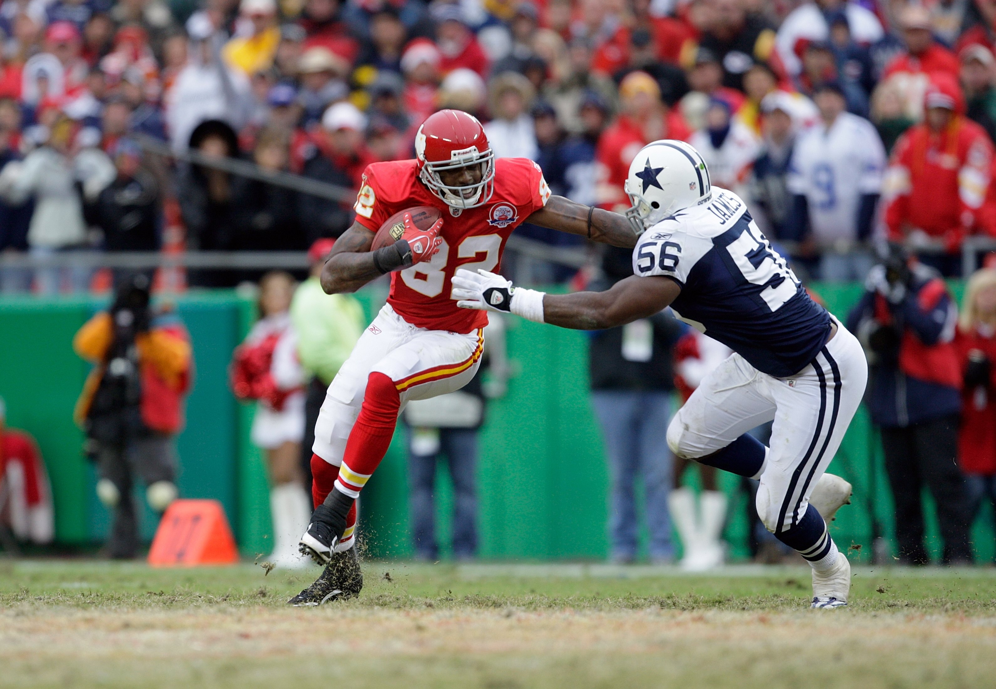 KANSAS CITY, MO - OCTOBER 11:  Dwayne Bowe #82 of the Kansas City Chiefs runs for yardage after a catch against Bradie James #56 of the Dallas Cowboys during the NFL game at Arrowhead Stadiumin on October 11, 2009 Kansas City, Missouri. The Cowboys defeat