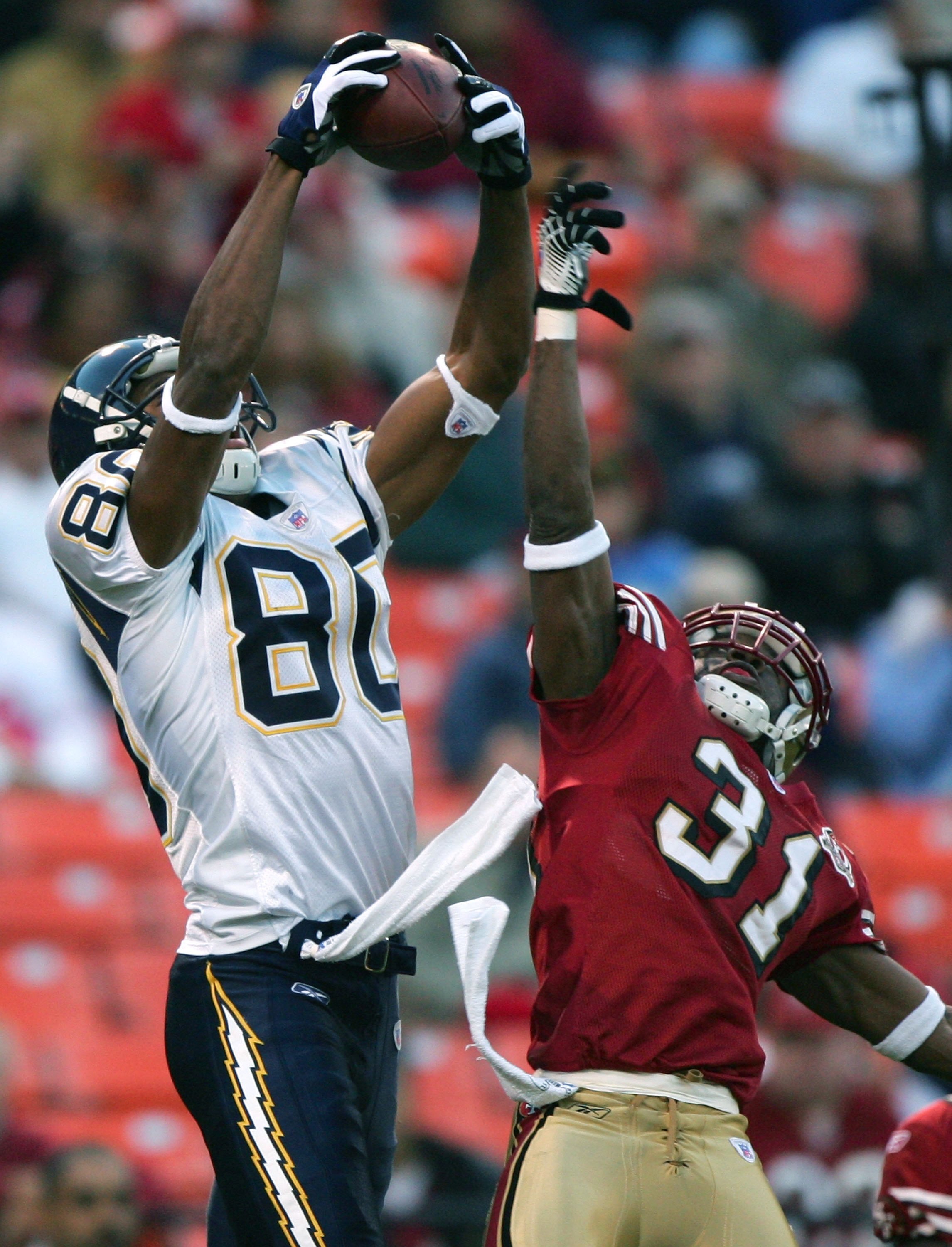 SAN FRANCISCO - SEPTEMBER 01:   Malcolm Floyd #80 of the San Diego Chargers catches a touchdown over Sammy Davis #31 of the San Francisco 49ers during a preseason NFL game at Monster Park on September 1, 2006 in San Francisco, California.  (Photo by Jed J