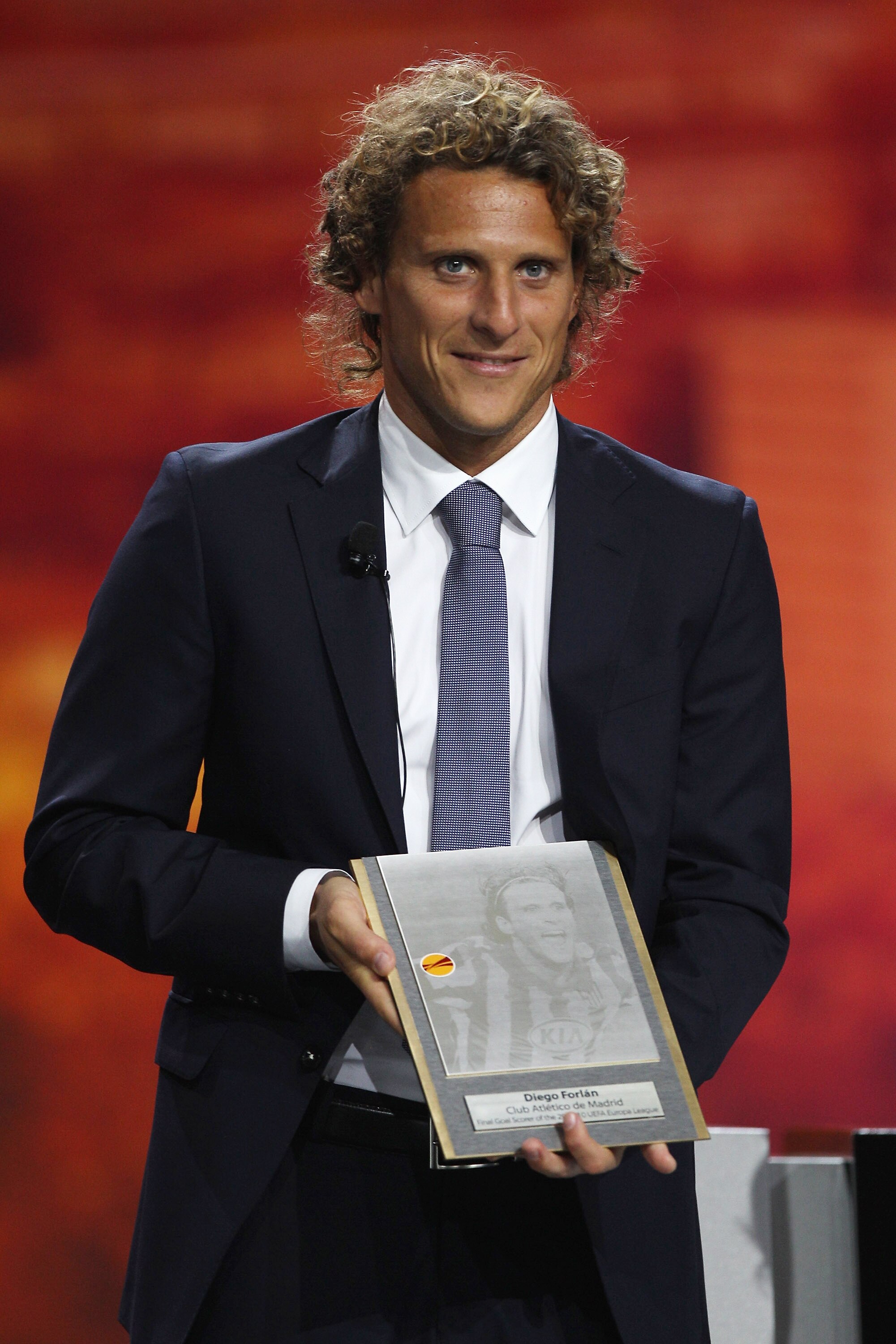 MONACO - AUGUST 27:  Diego Forlan of Atletico Madrid and Uruguay receives a plaque for scoring the winning goal in last seasons Europa League final during the UEFA Europa League Group Stage Draw at the Grimaldi Forum on August 27, 2010 in Monaco, Monaco.