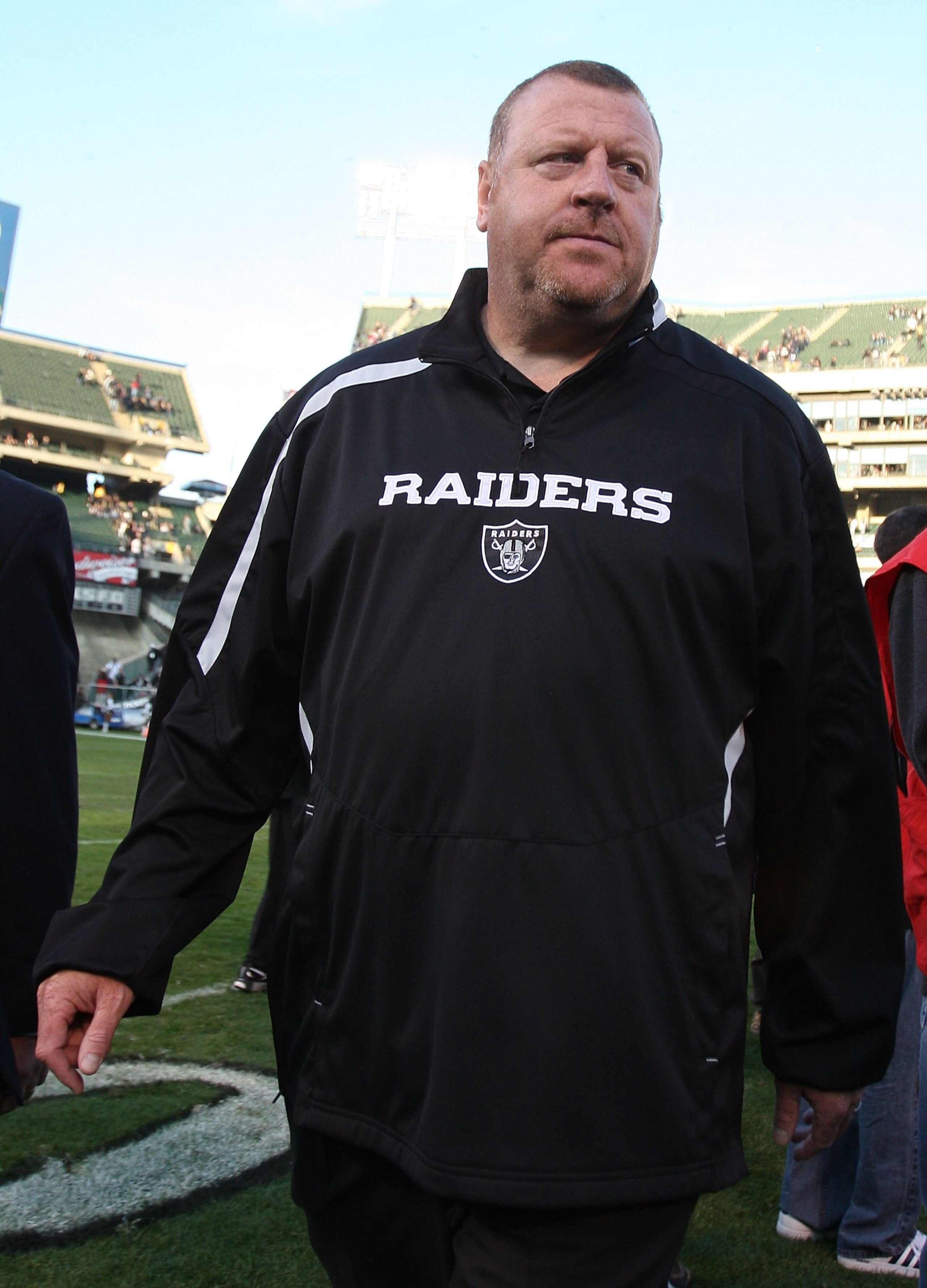 OAKLAND, CA - JANUARY 03:  Head coach Tom Cable of the Oakland Raiders walks off the field after losing to the Baltimore Ravens during an NFL game at Oakland-Alameda County Coliseum on January 3, 2010 in Oakland, California.  (Photo by Jed Jacobsohn/Getty