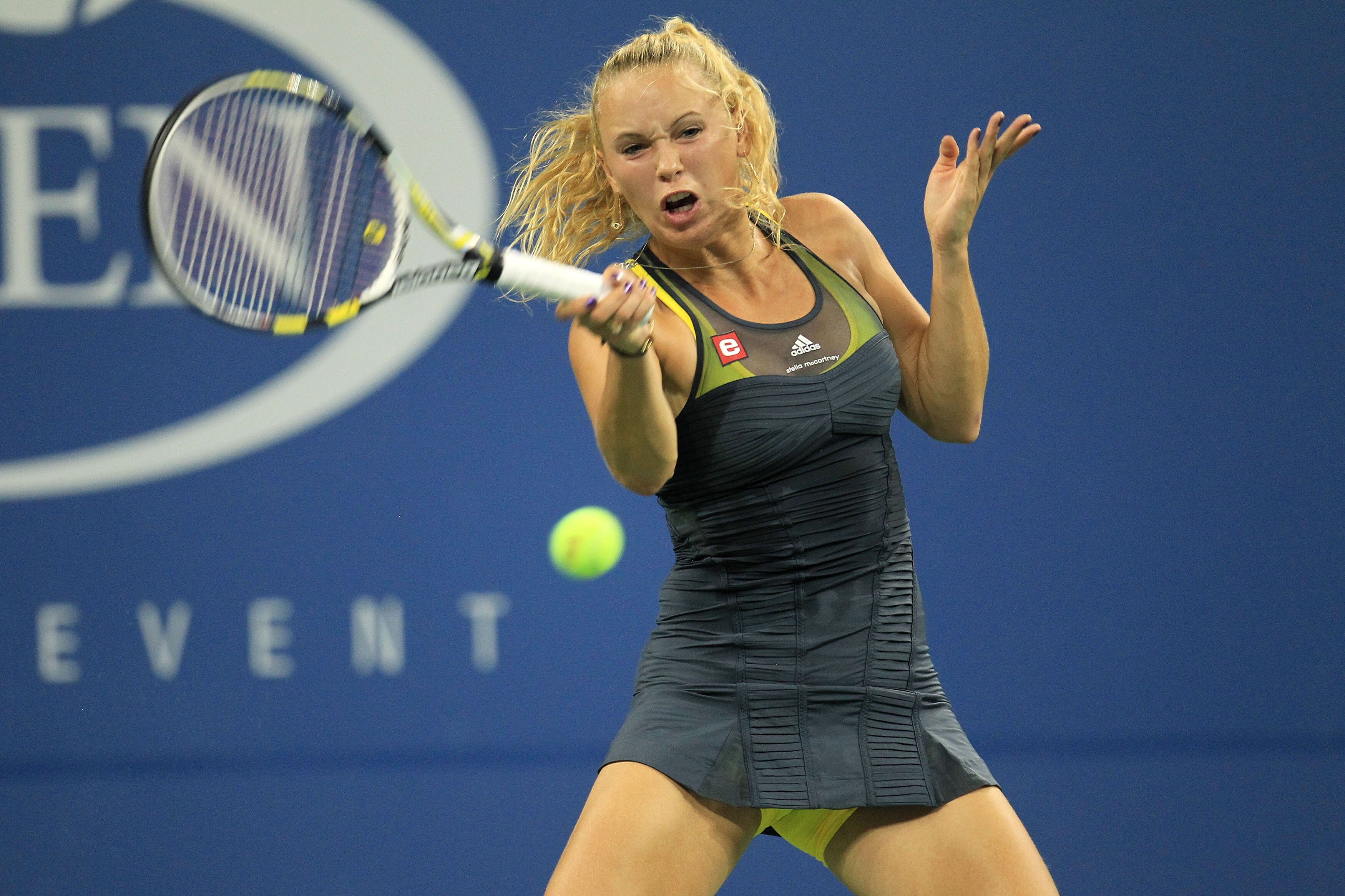 NEW YORK - AUGUST 31:  Caroline Wozniacki of Denmark returns a shot against Chelsey Gullickson of the United States during her first round women's singles match on day two of the 2010 U.S. Open at the USTA Billie Jean King National Tennis Center on August