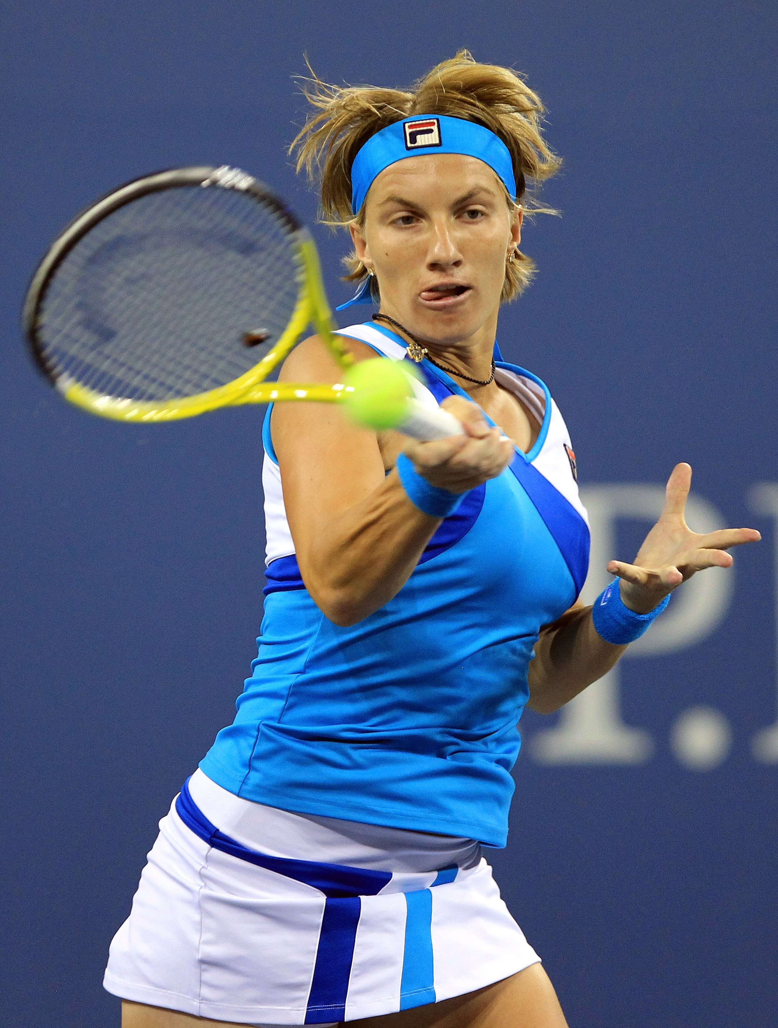 NEW YORK - SEPTEMBER 04:  Svetlana Kuznetsova of Russia returns a shot against Maria Kirilenko of Russia during her women's singles match on day six of the 2010 U.S. Open at the USTA Billie Jean King National Tennis Center on September 4, 2010 in the Flus