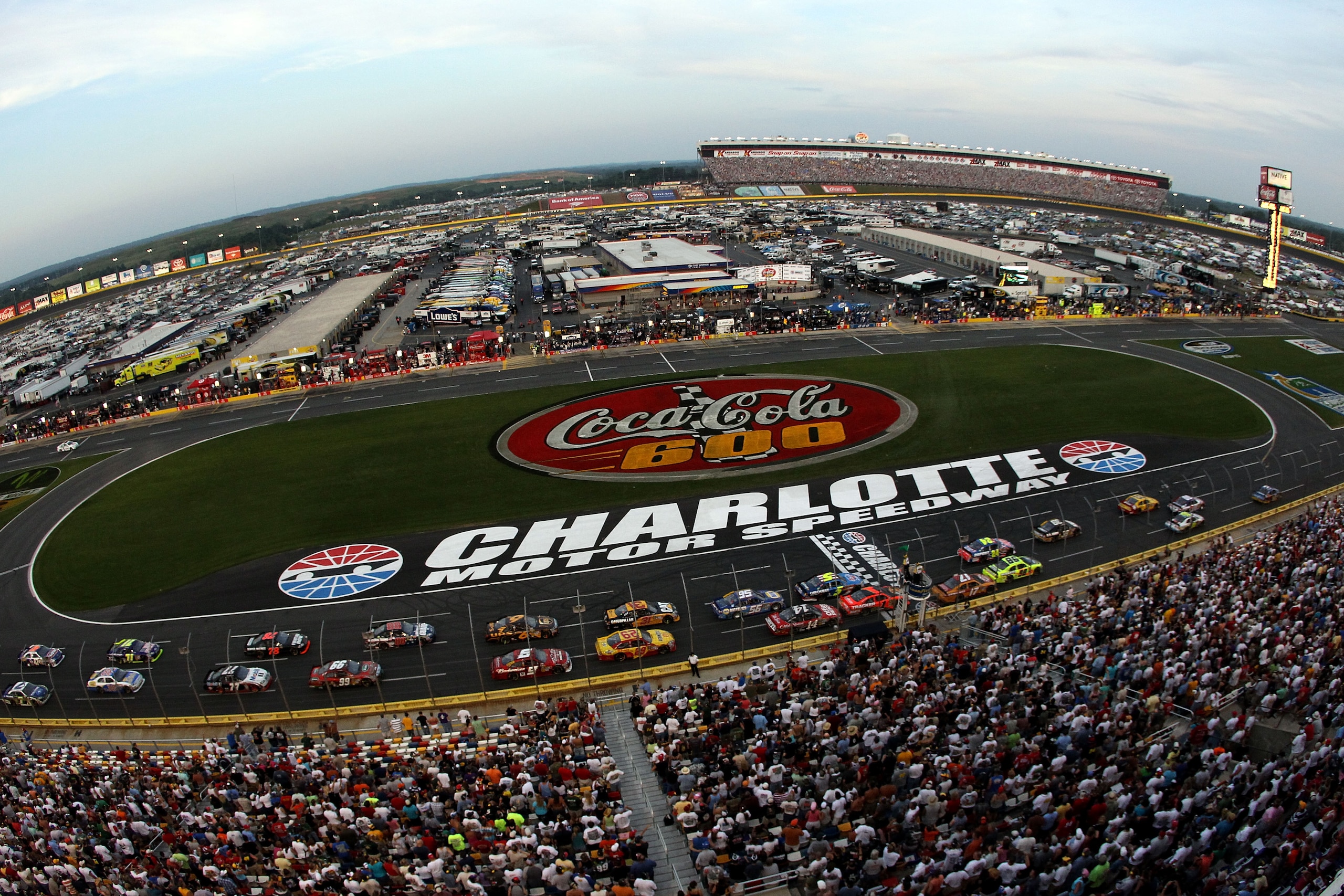 CONCORD, NC - MAY 30:  Kurt Busch, driver of the #2 Miller Lite/Vortex Dodge, leads the field during the NASCAR Sprint Cup Series Coca-Cola 600 at Charlotte Motor Speedway on May 30, 2010 in Concord, North Carolina.  (Photo by Streeter Lecka/Getty Images)