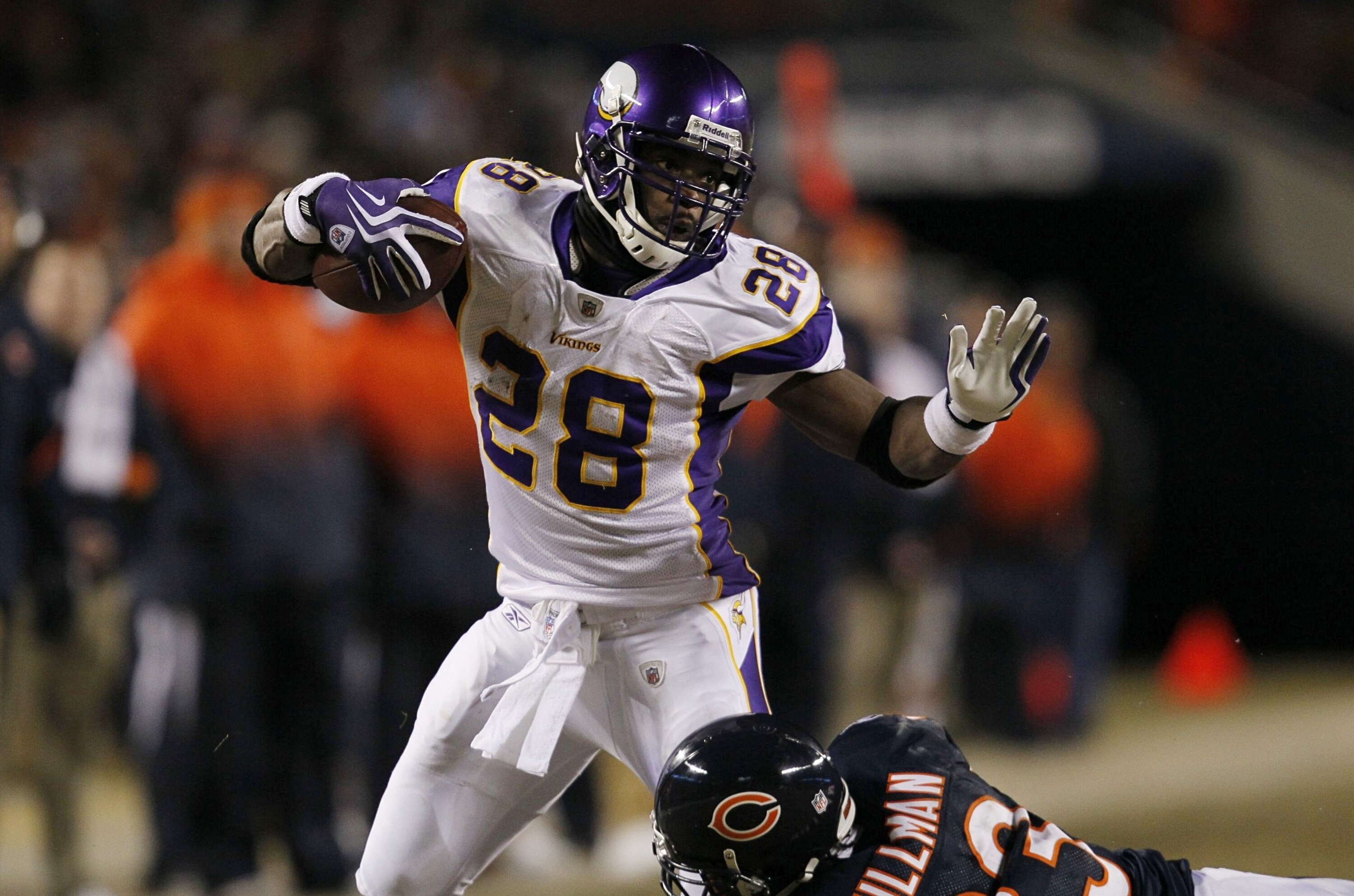 CHICAGO - DECEMBER 28:  Adrian Peterson #28 of the Minnesota Vikings runs the ball against Charles Tillman #33 of the Chicago Bears in the first half at Soldier Field on December 28, 2009 in Chicago, Illinois. (Photo by Jonathan Daniel/Getty Images)