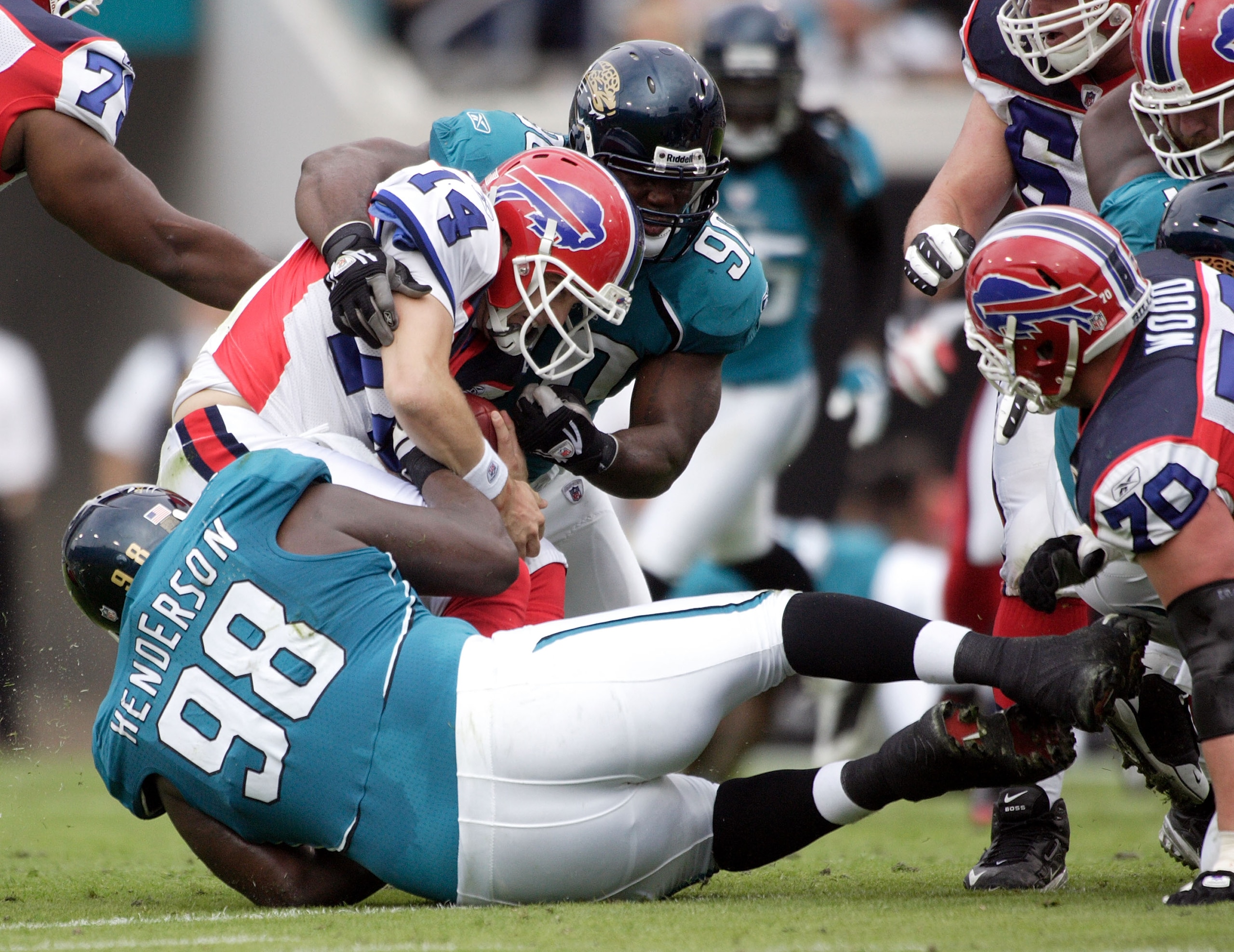 JACKSONVILLE, FL - NOVEMBER 22:  Quarterback Trent Edwards #5 of the Buffalo Bills passes is sacked by defensive end John Henderson #98 of the Jacksonville Jaguars at Jacksonville Municipal Stadium on November 22, 2009 in Jacksonville, Florida.  (Photo by
