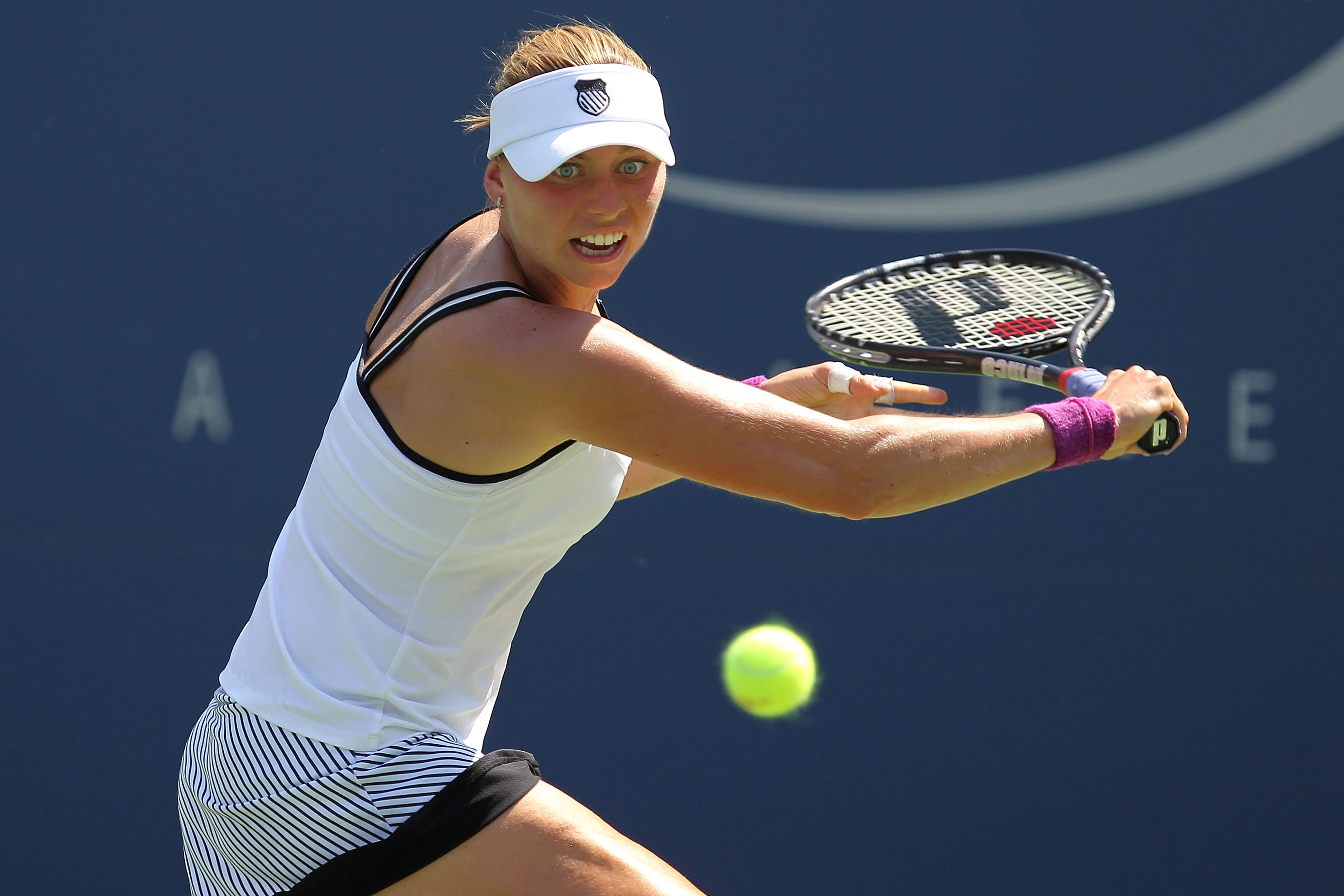 NEW YORK - SEPTEMBER 02:  Vera Zvonareva of Russia hits a backhand return shot against Sabine Liscki of Germany during her women's singles match on day four of the 2010 U.S. Open at the USTA Billie Jean King National Tennis Center on September 2, 2010 in 