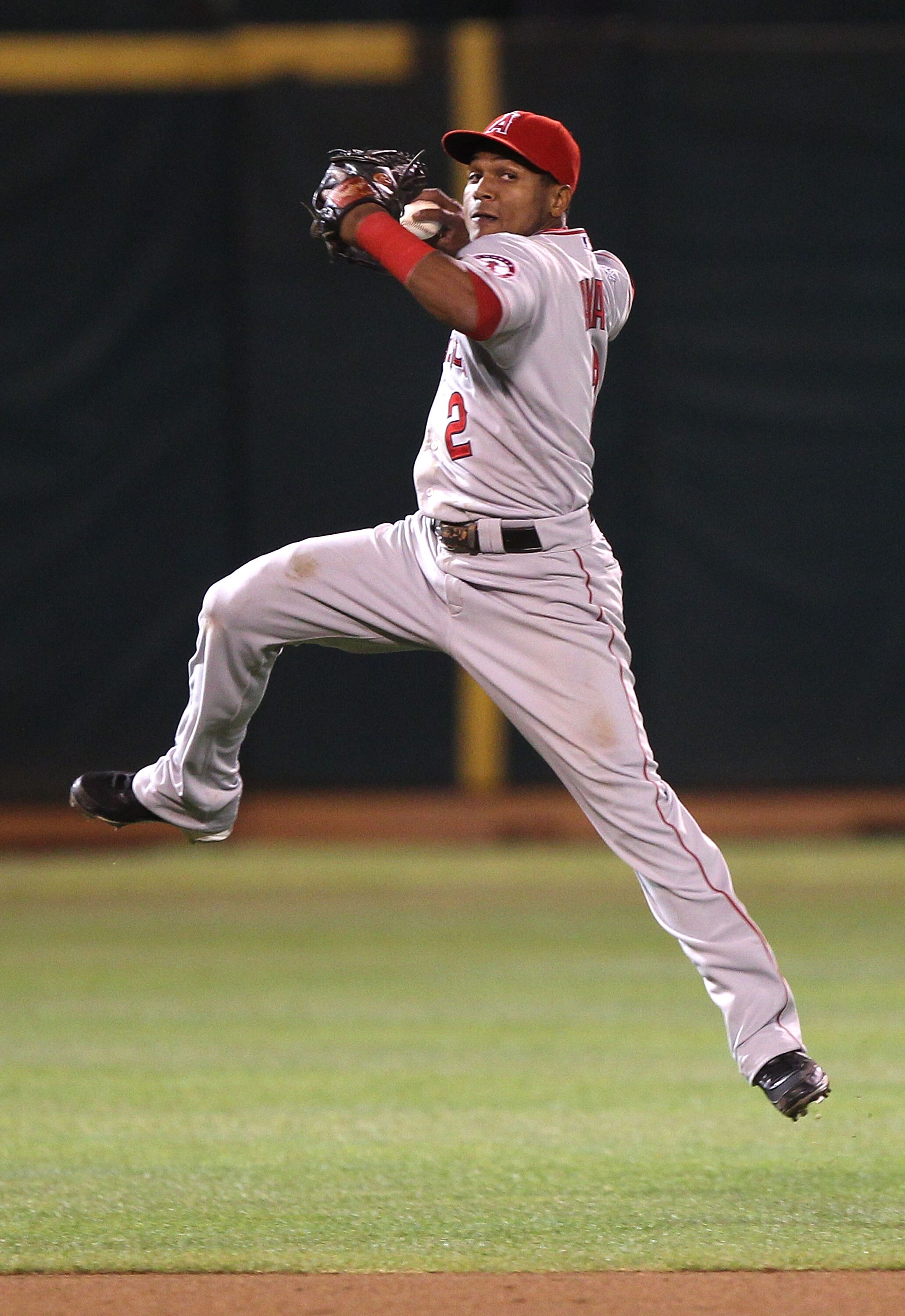 OAKLAND, CA - SEPTEMBER 3:  Erick Aybar #2 of the Los Angeles Angels of Anaheim fails to throw out Kurt Suzuki of the Oakland Athletics in the seventh inning during a Major League Baseball game at the Oakland-Alameda County Coliseum on September 3, 2010 i