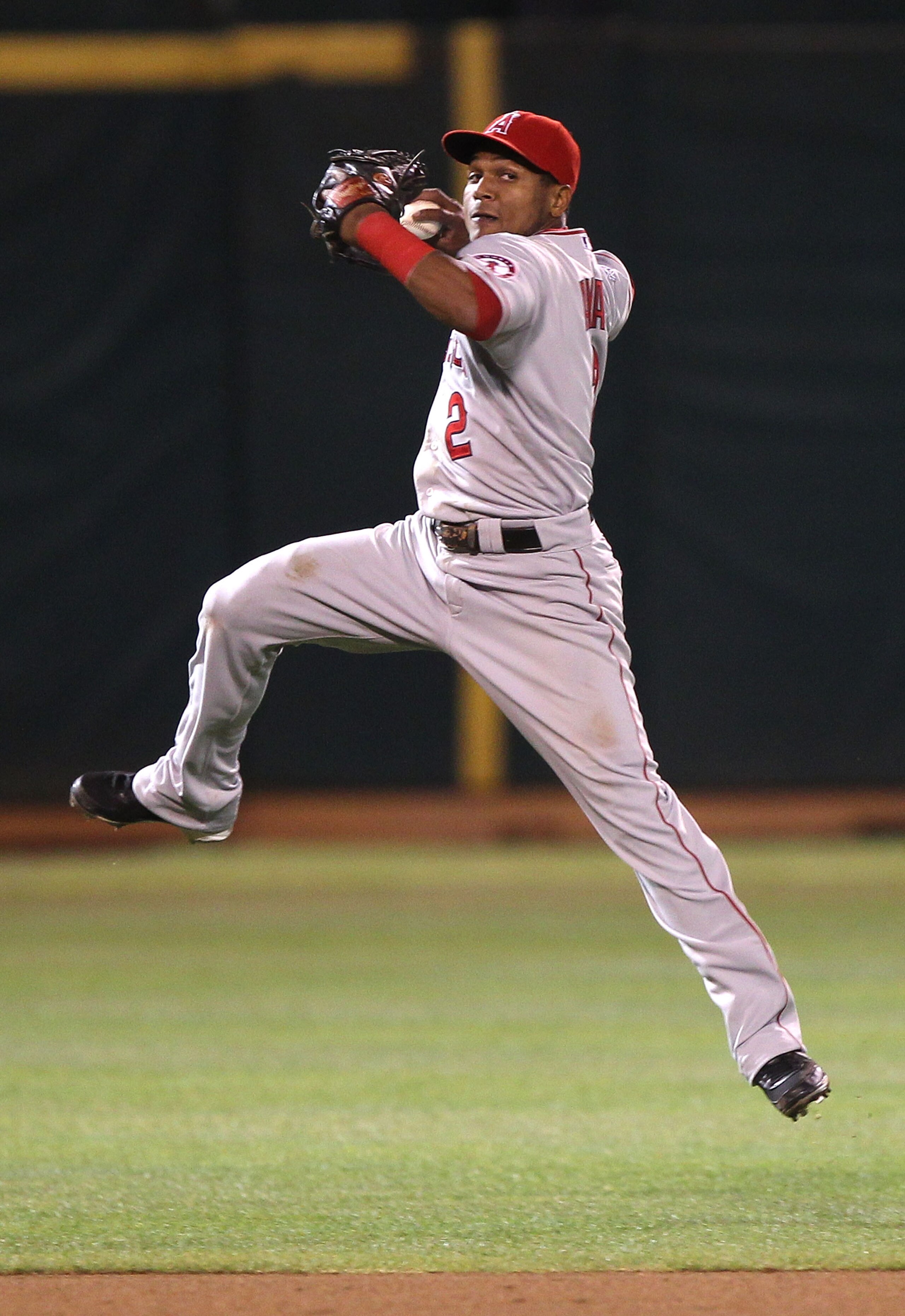 OAKLAND, CA - SEPTEMBER 3:  Erick Aybar #2 of the Los Angeles Angels of Anaheim fails to throw out Kurt Suzuki of the Oakland Athletics in the seventh inning during a Major League Baseball game at the Oakland-Alameda County Coliseum on September 3, 2010 i