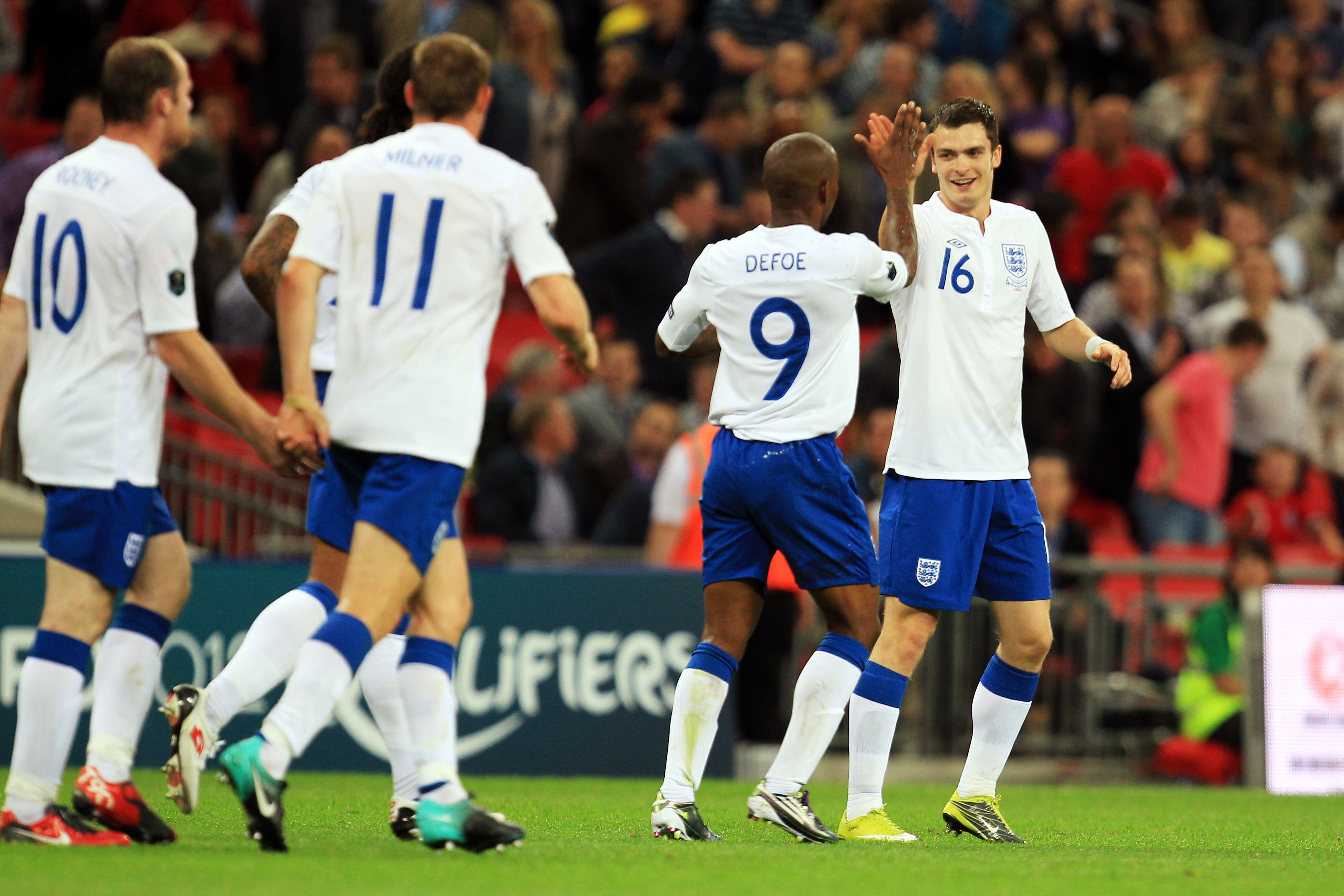 LONDON, ENGLAND - SEPTEMBER 03: Adam Johnson (right) of England celebrates with team mate Jermain Defoe (2nd right) after scoring the third goal of the game during the UEFA EURO 2012 Group G Qualifying match between England and Bulgaria at Wembley Stadiu LONDON, ENGLAND - SEPTEMBER 03: Adam Johnson (right) of England celebrates with team mate Jermain Defoe (2nd right) after scoring the third goal of the game during the UEFA EURO 2012 Group G Qualifying match between England and Bulgaria at Wembley Stadiu