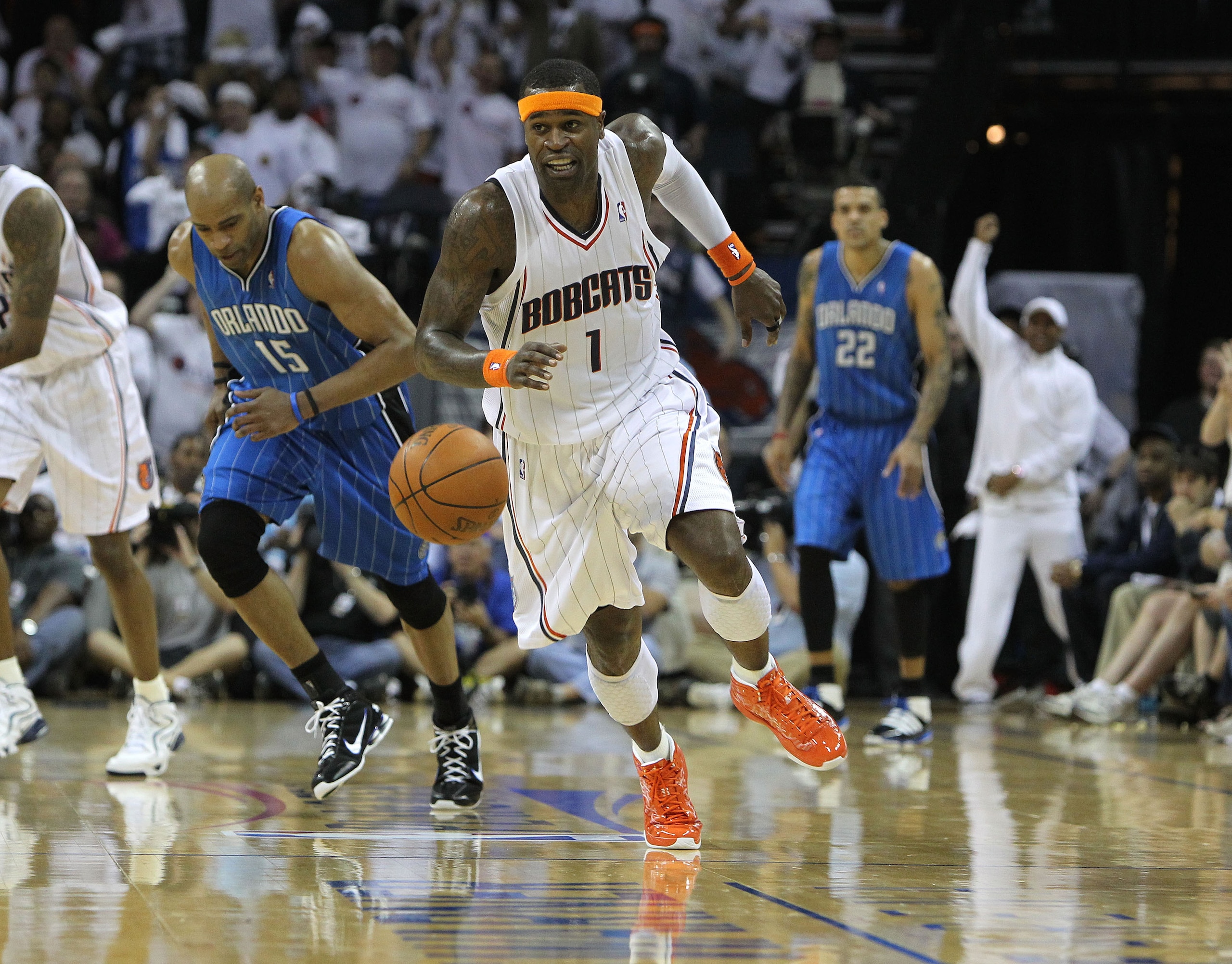 CHARLOTTE, NC - APRIL 24:  Guard Stephen Jackson #1 of the Charlotte Bobcats chases a loose ball while guard Vince Carter #15 of the Orlando Magic pursues during Game Three of the Eastern Conference Quarterfinals during the 2010 NBA Playoffs at Time Warne