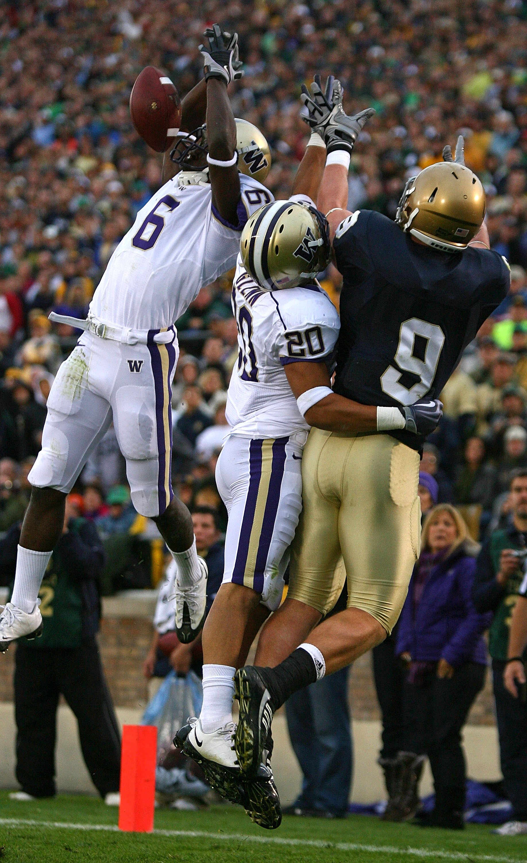 SOUTH BEND, IN - OCTOBER 03: Desmond Trufant #6 of the Washington Huskies breaks up a pass intended for Kyle Rudolph #9 of the Notre Dame Fighting Irish as teammate Justin Glenn #20 also defends on October 3, 2009 at Notre Dame Stadium in South Bend, Indi SOUTH BEND, IN - OCTOBER 03: Desmond Trufant #6 of the Washington Huskies breaks up a pass intended for Kyle Rudolph #9 of the Notre Dame Fighting Irish as teammate Justin Glenn #20 also defends on October 3, 2009 at Notre Dame Stadium in South Bend, Indi