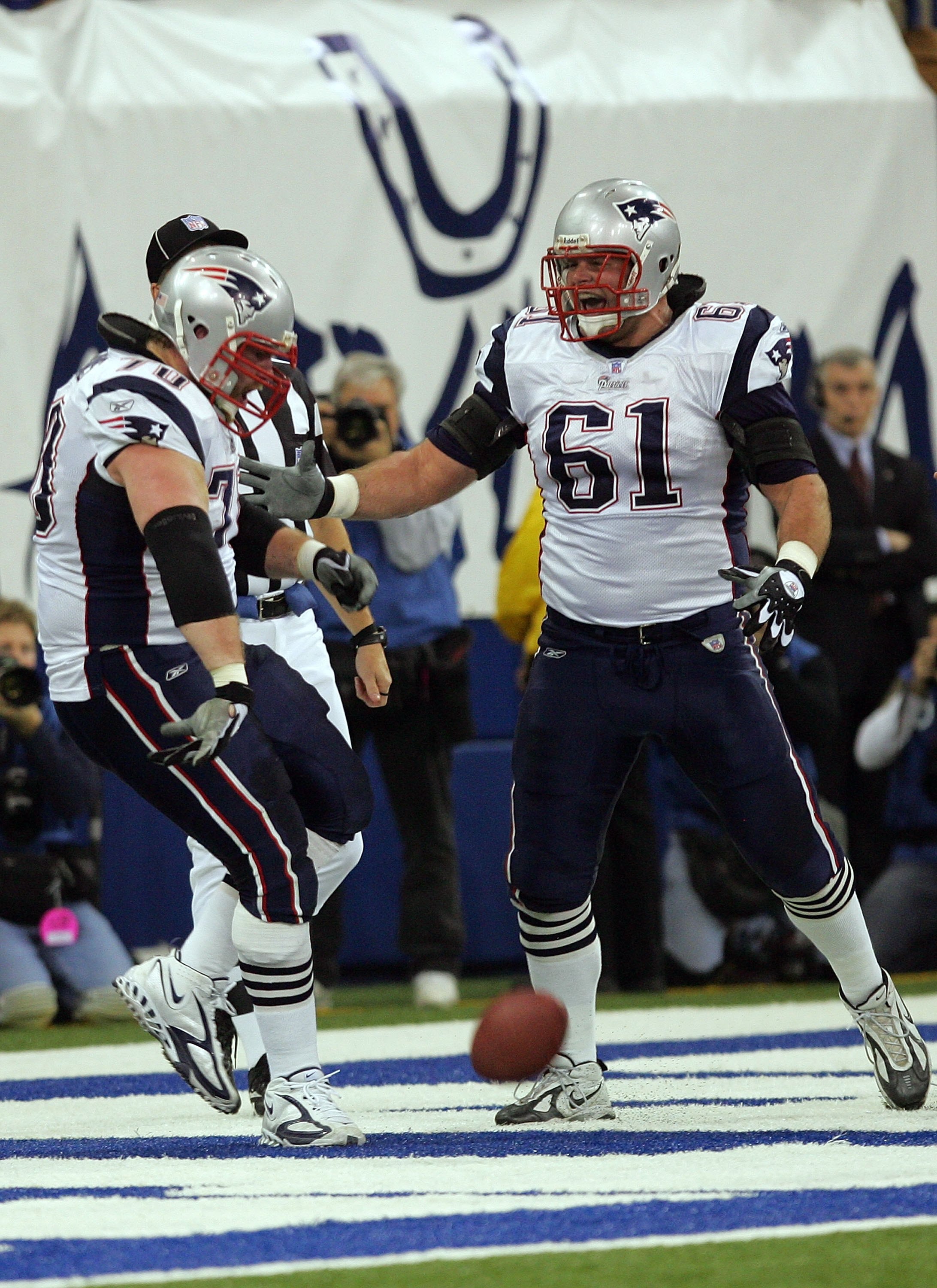 INDIANAPOLIS - JANUARY 21:  Logan Mankins #70 of the New England Patriots and teammate Stephen Neal #61 celebrate Mankins' first quarter touchdown on a fumble recovery at the one-yard line of the Indianapolis Colts during the AFC Championship Game on Janu