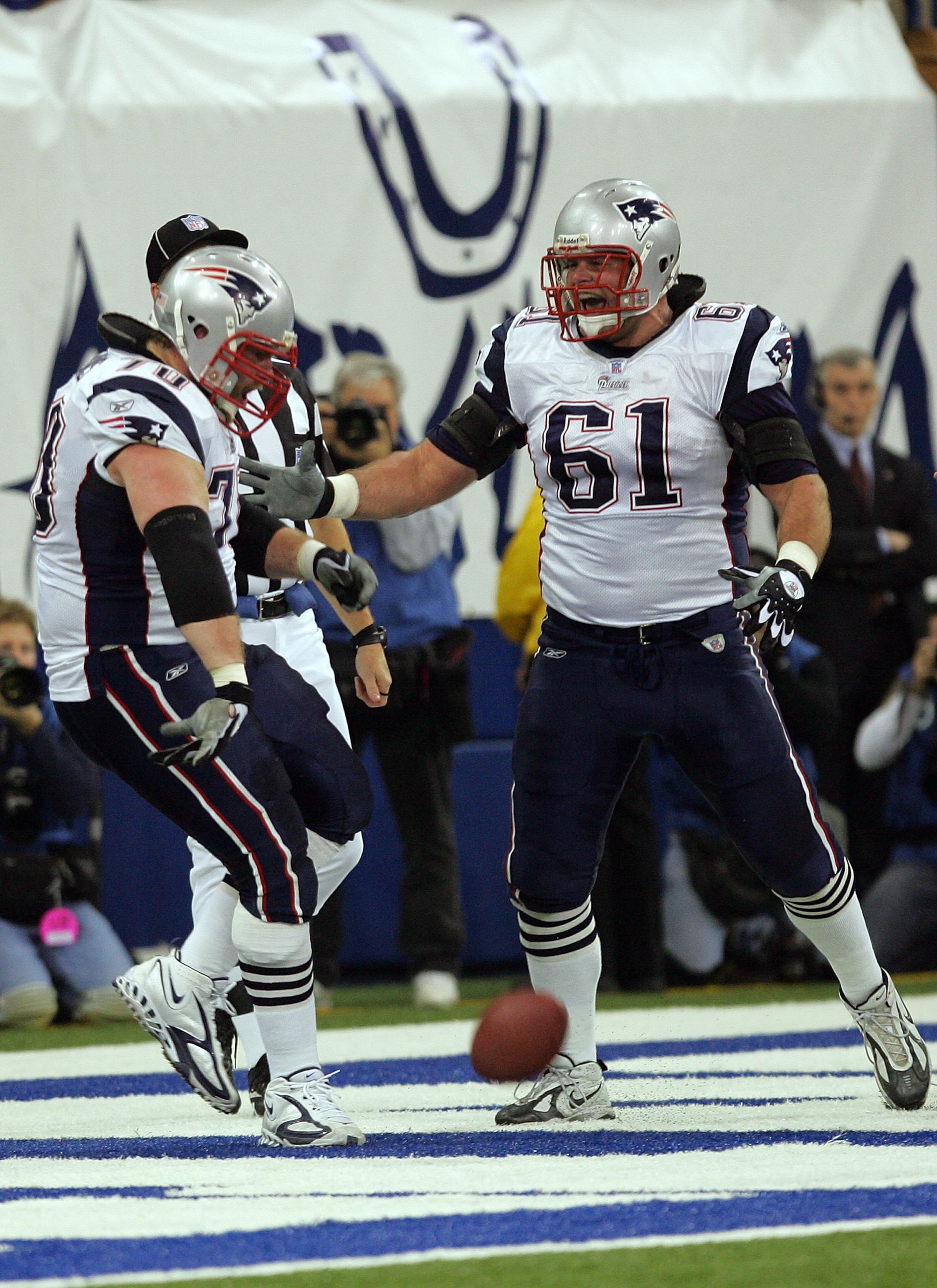 INDIANAPOLIS - JANUARY 21:  Logan Mankins #70 of the New England Patriots and teammate Stephen Neal #61 celebrate Mankins' first quarter touchdown on a fumble recovery at the one-yard line of the Indianapolis Colts during the AFC Championship Game on Janu