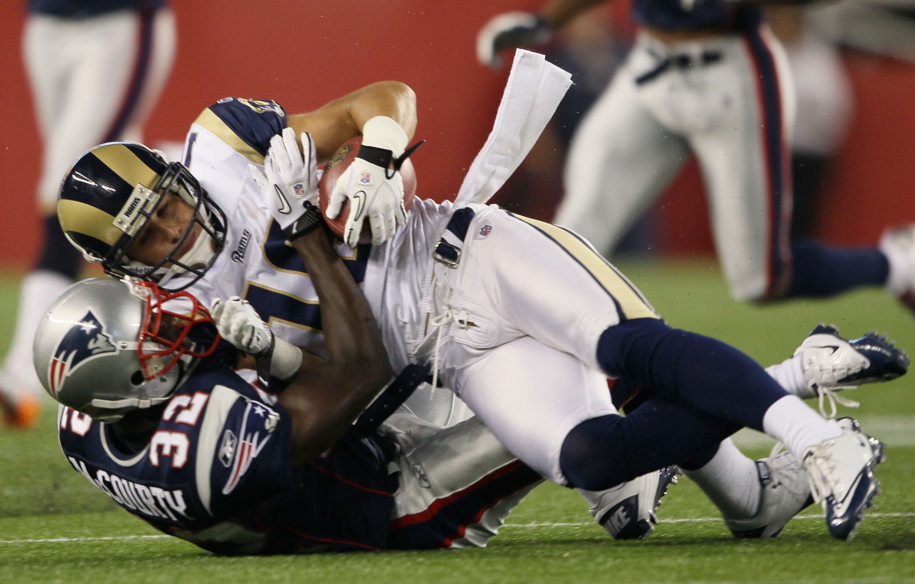 FOXBORO, MA - AUGUST 26:  Danny Amendola #16 of the St. Louis Rams is tackled by Devin McCourty #32 of the New England Patriots on August 26, 2010 at Gillette Stadium in Foxboro, Massachusetts.  (Photo by Elsa/Getty Images)