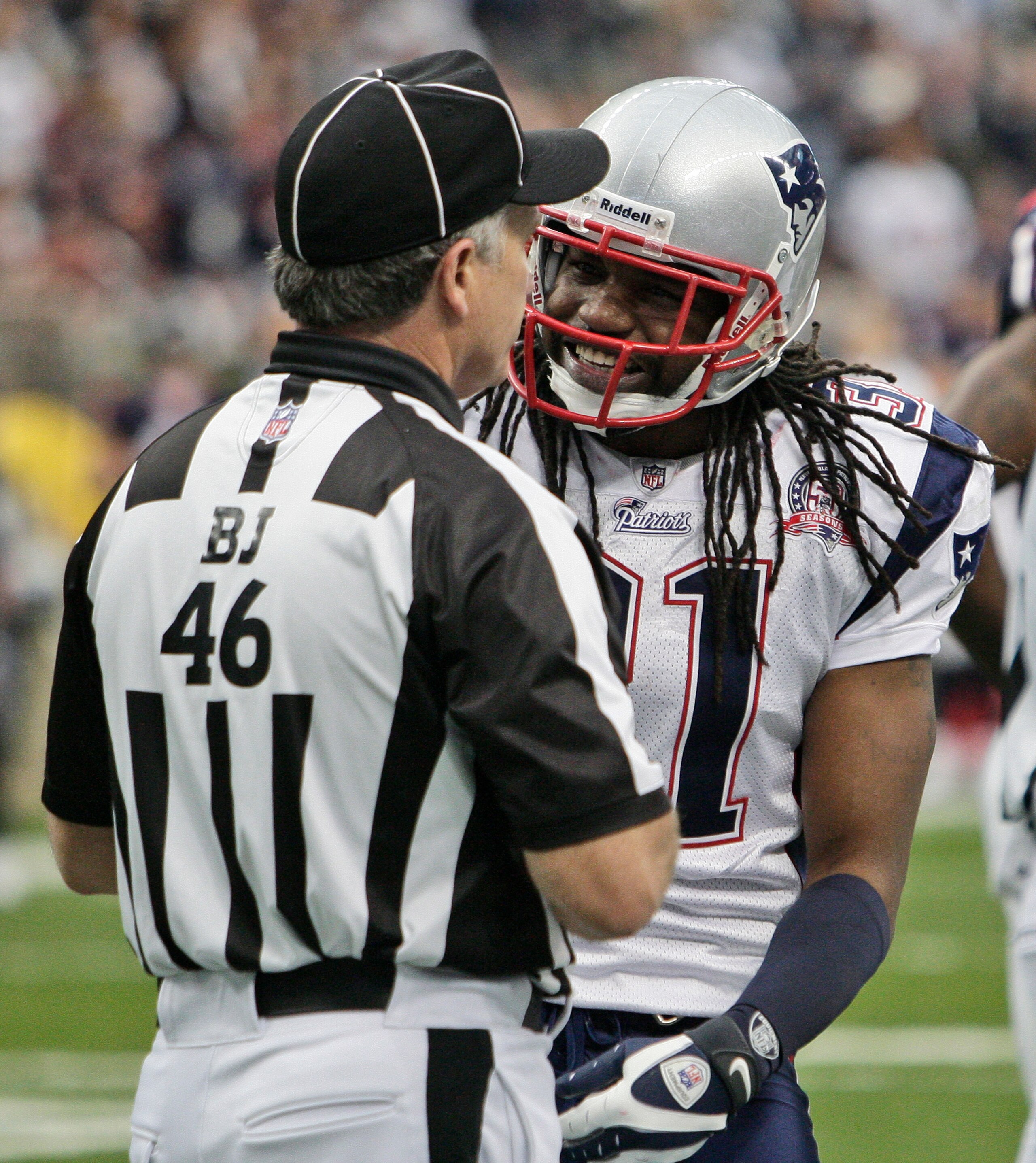 HOUSTON - JANUARY 03:  Safety Brandon Meriweather #31 of the New  England Patriots talks with back judge Perry Paganalli #46 after a personal foul was called on safety James Sanders at Reliant Stadium on January 3, 2010 in Houston, Texas.  (Photo by Bob L