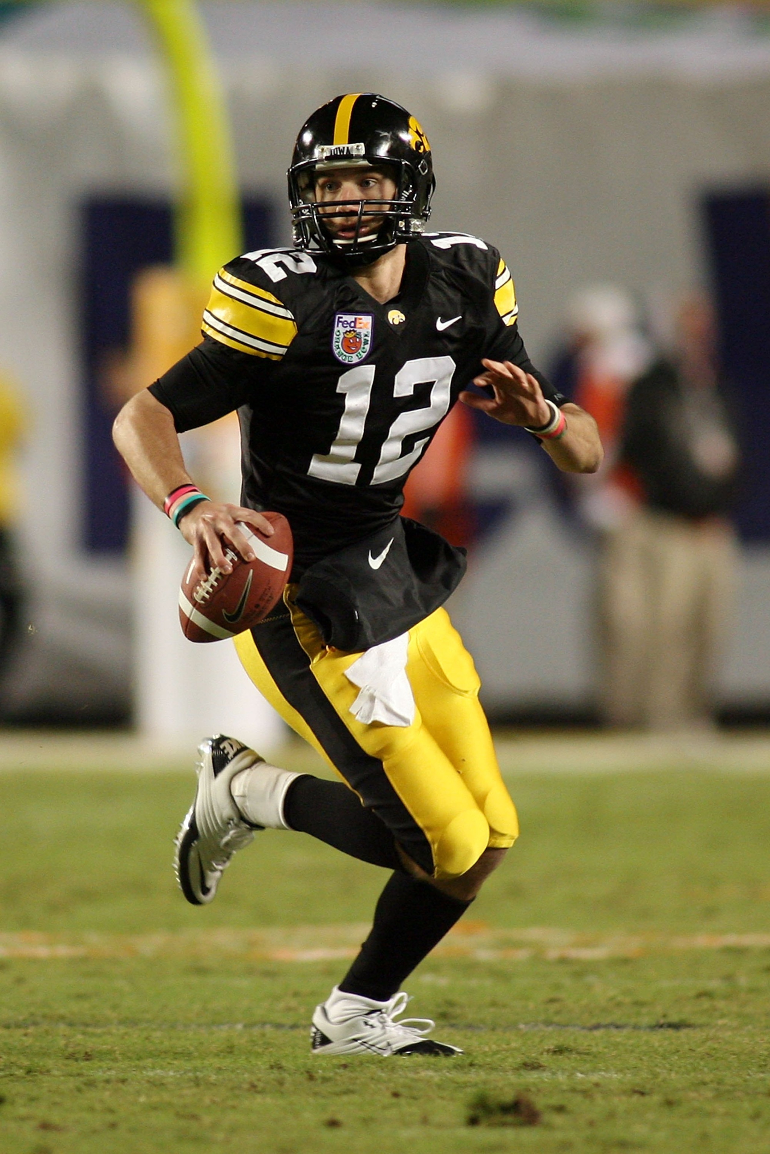MIAMI GARDENS, FL - JANUARY 05: Quarterback Richy Stanzi #12 of the Iowa Hawkeyes rolls out of the pocket against the Georgia Tech Yellow Jackets during the FedEx Orange Bowl at Land Shark Stadium on January 5, 2010 in Miami Gardens, Florida. Iowa won 24 MIAMI GARDENS, FL - JANUARY 05: Quarterback Richy Stanzi #12 of the Iowa Hawkeyes rolls out of the pocket against the Georgia Tech Yellow Jackets during the FedEx Orange Bowl at Land Shark Stadium on January 5, 2010 in Miami Gardens, Florida. Iowa won 24