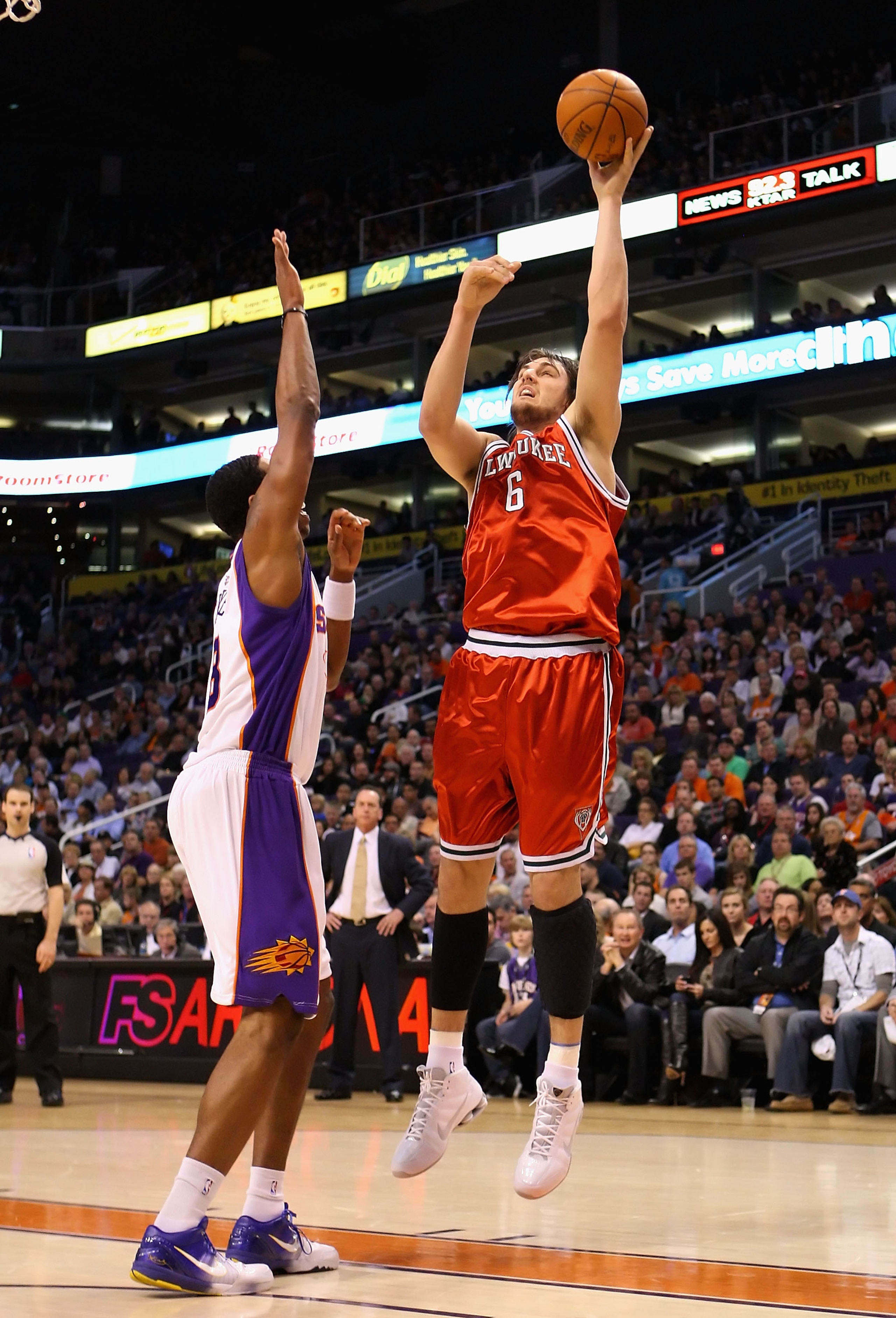 PHOENIX - JANUARY 11:  Andrew Bogut #6 of the Milwaukee Bucks puts up a shot over Channing Frye #8 of the Phoenix Suns during the NBA game at US Airways Center on January 11, 2010 in Phoenix, Arizona. NOTE TO USER: User expressly acknowledges and agrees t