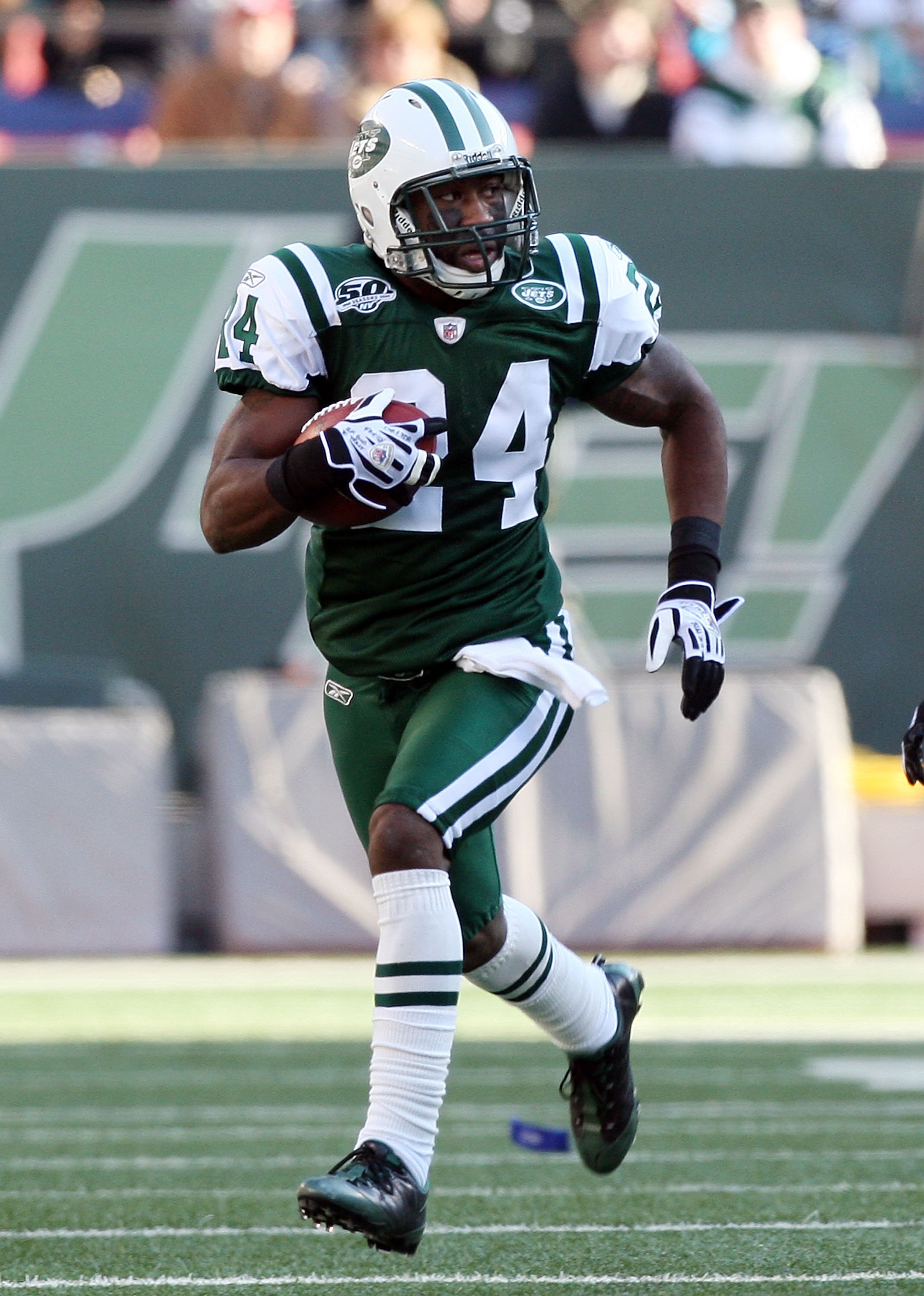 EAST RUTHERFORD, NJ - NOVEMBER 29:  Darrelle Revis #24 of the New York Jets runs the ball in for a first quarter touchdown after an interception against the Carolina Panthers on November 29, 2009 at Giants Stadium in East Rutherford, New Jersey.  (Photo b