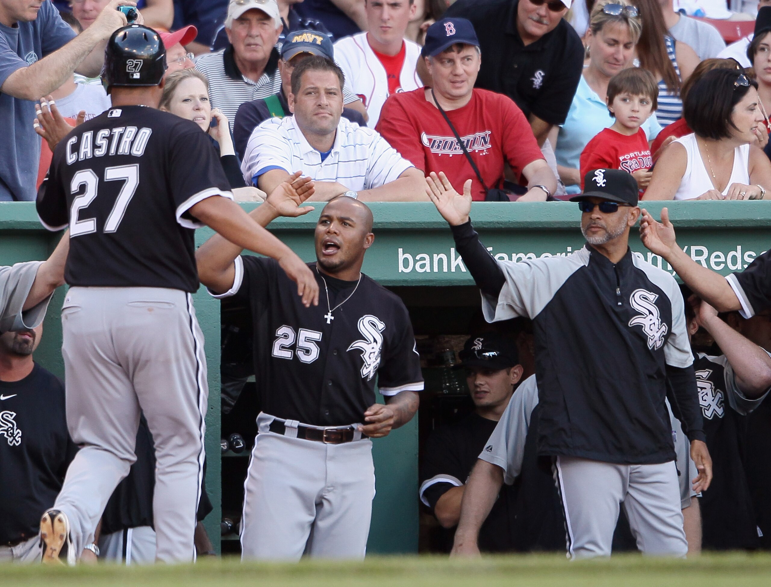 BOSTON - SEPTEMBER 05:  Ramon Castro #27 of the Chicago White Sox is congratulated by Andruw Jones #25 after Castro scored the game winning run on a bases loaded walk in the ninth inning against the Boston Red Sox September 5, 2010 at Fenway Park in Bosto