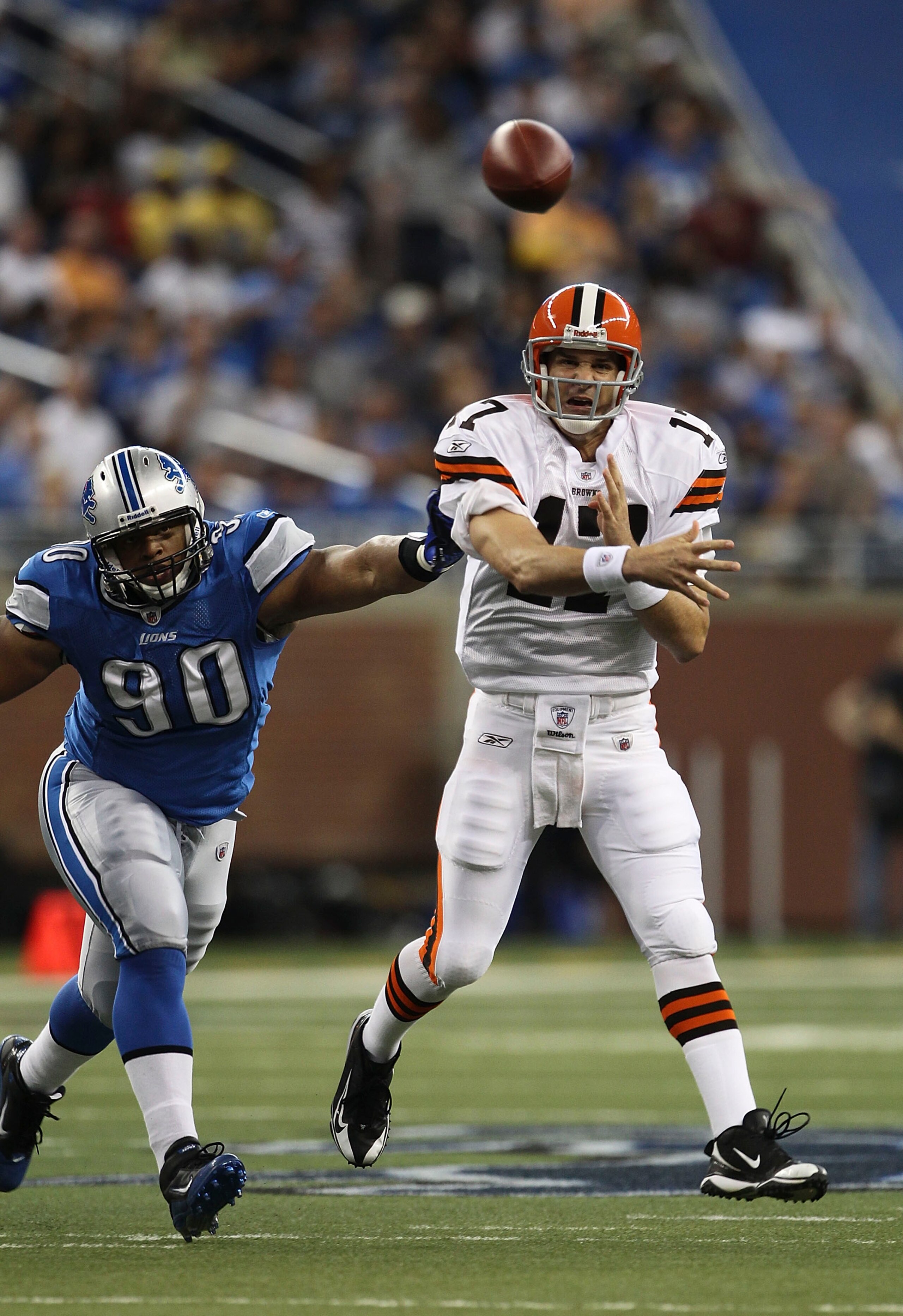 DETROIT - AUGUST 28: Jake Delhomme #17 of the Cleveland Browns rolls out and throws a pass as Ndamukong Suh #90 of the Detroit Lions pursues during the second quarter of the preseason game at Ford Field on August 28, 2010 in Detroit, Michigan. The Lions d