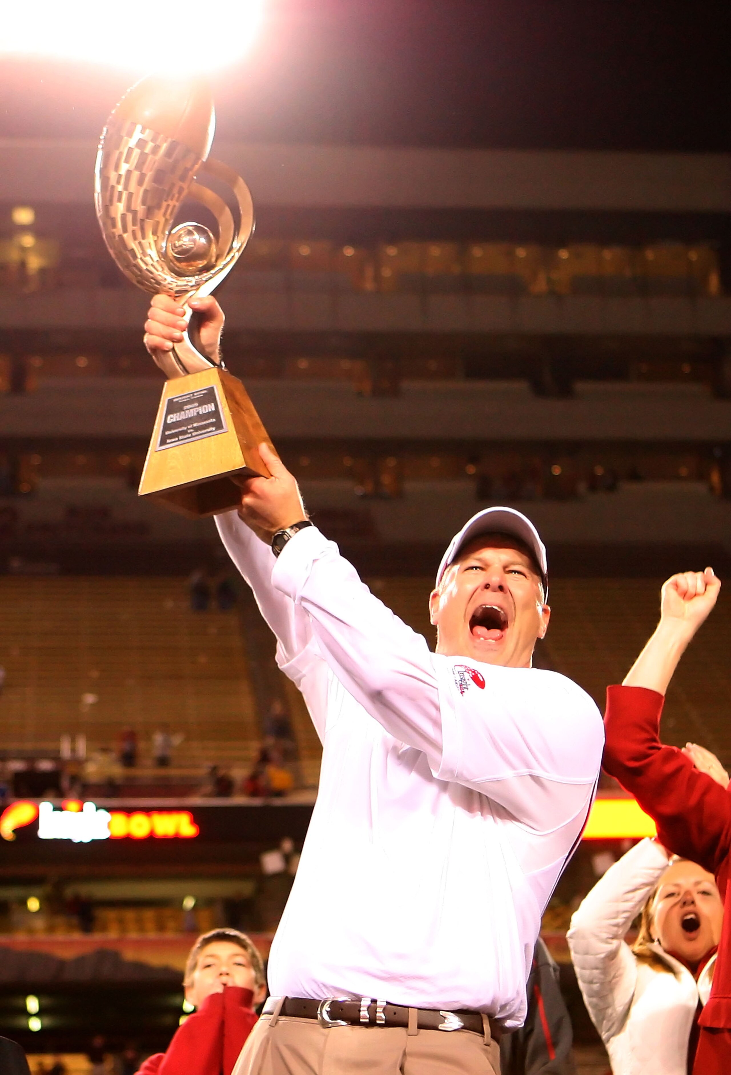 TEMPE, AZ - DECEMBER 31: Head coach Paul Rhoads of the Iowa State Cyclones celebrates with the Insight Bowl trophy after defeating the Minnesota Golden Gophers at Arizona Stadium on December 31, 2009 in Tempe, Arizona. The Cyclones defeated the Golden G TEMPE, AZ - DECEMBER 31: Head coach Paul Rhoads of the Iowa State Cyclones celebrates with the Insight Bowl trophy after defeating the Minnesota Golden Gophers at Arizona Stadium on December 31, 2009 in Tempe, Arizona. The Cyclones defeated the Golden G