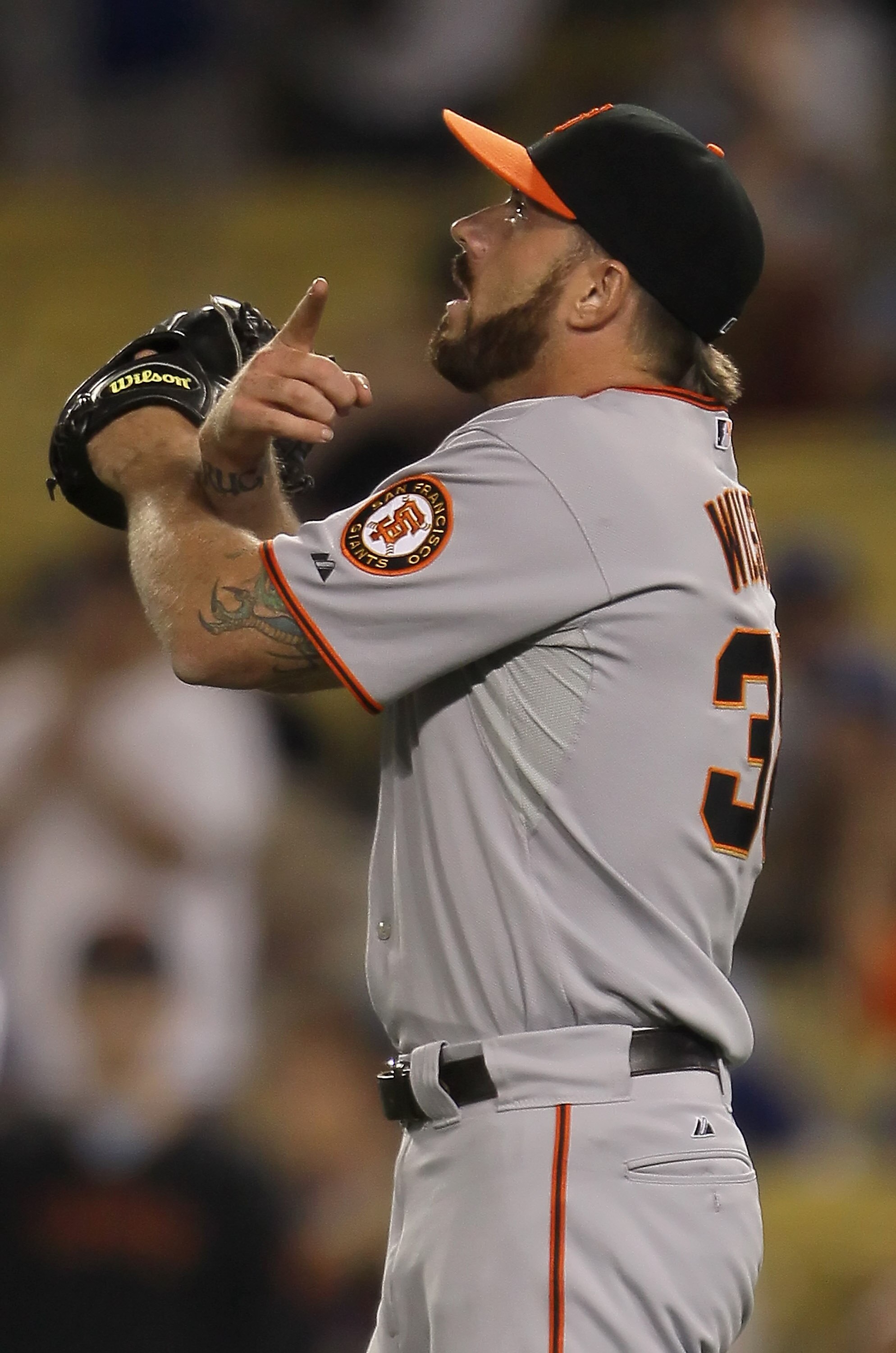 LOS ANGELES, CA - SEPTEMBER 05:  Brian Wilson #38 of the San Francisco Giants gestures after earning a save against the Los Angeles Dodgers at Dodger Stadium on September 5, 2010 in Los Angeles, California. The Giants defeated the Dodgers 3-0.  (Photo by 