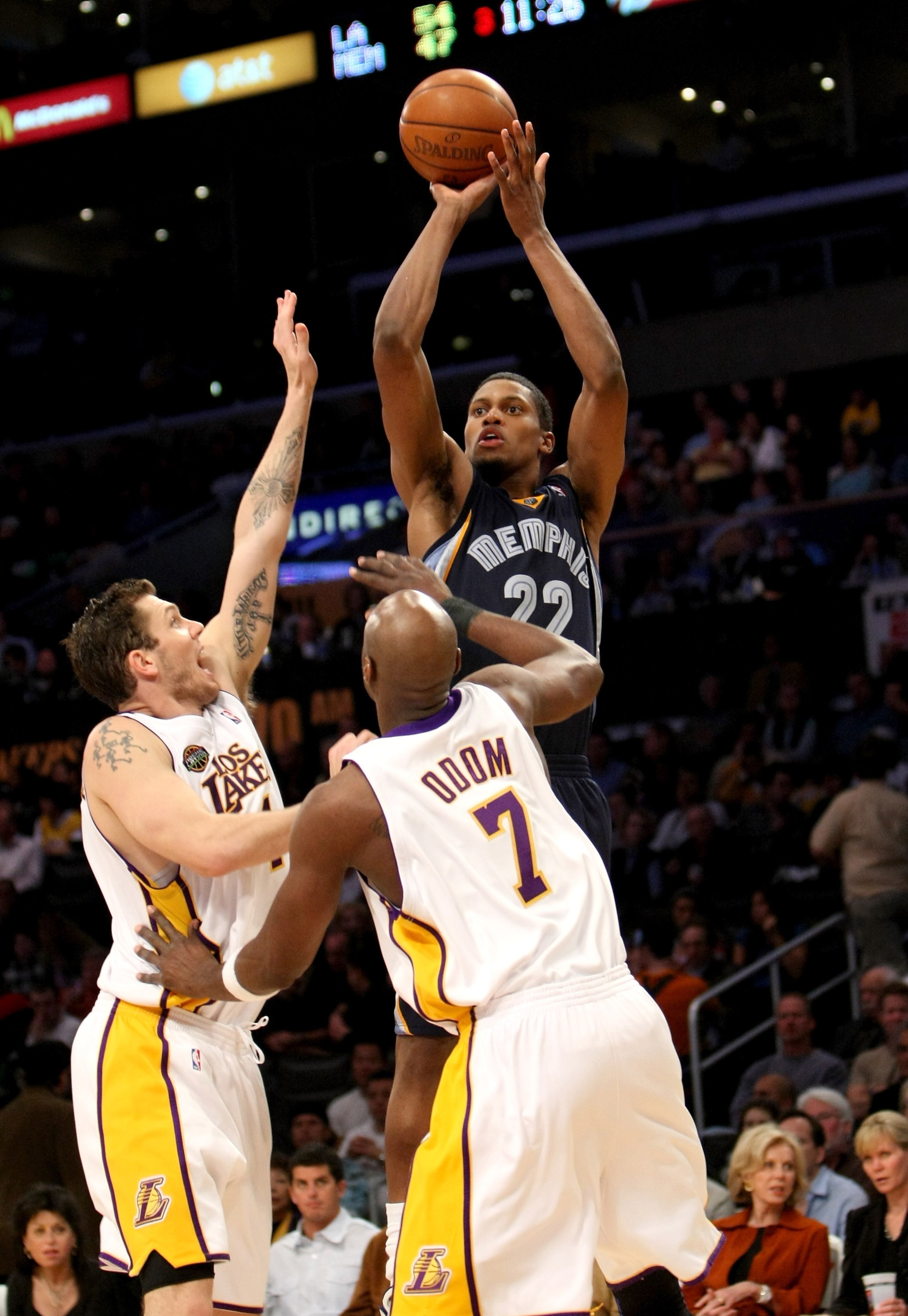 LOS ANGELES - MARCH 3:  Rudy Gay #22 of the Memphis Grizzlies shoots over Luke Walton #4 and lamar Odom #7 of the Los Angeles Lakers on March 3, 2009 at Staples Center in Los Angeles, California.  The Lakers won 99-89.   NOTE TO USER: User expressly ackno