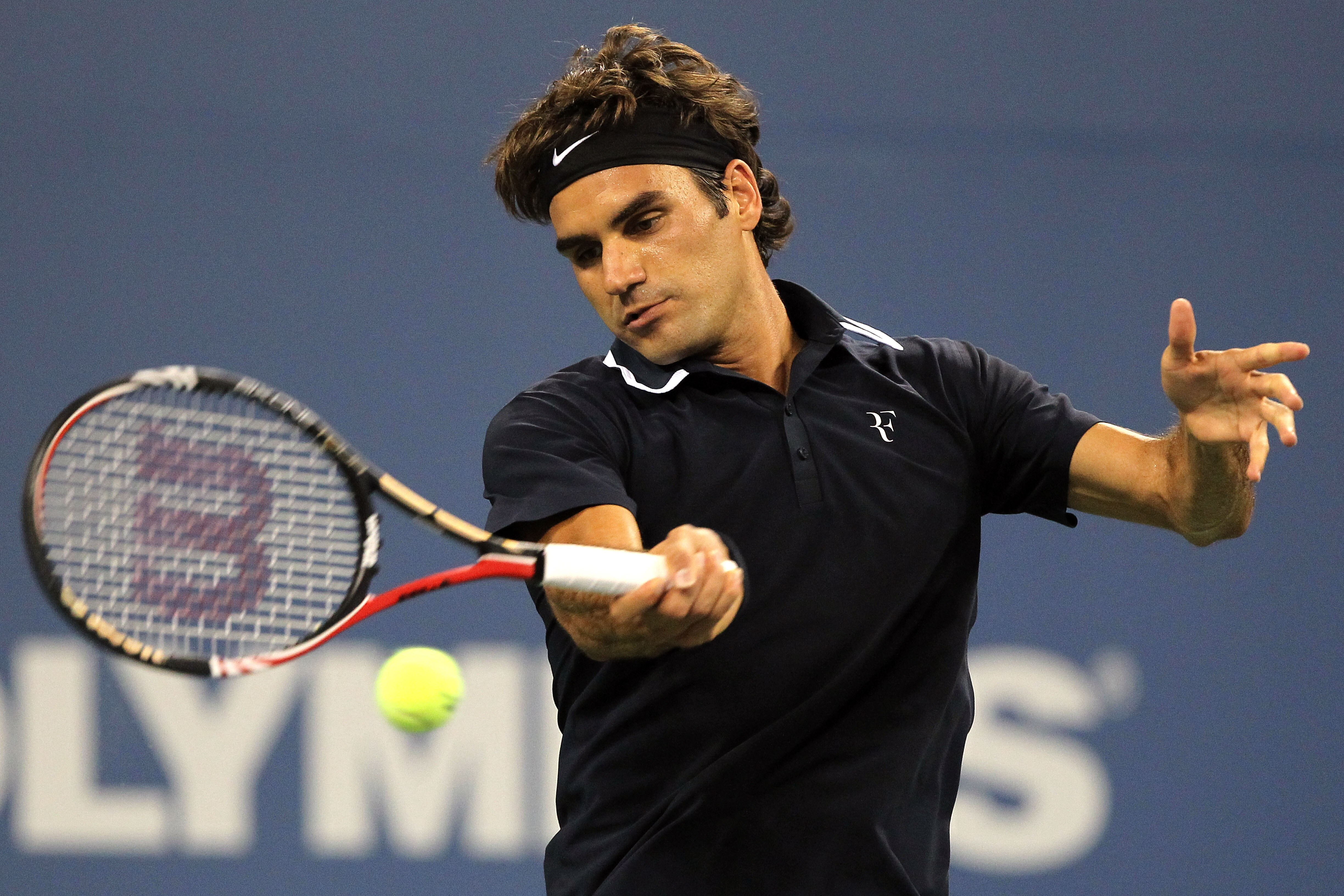 NEW YORK - AUGUST 30:  Roger Federer of Switzerland returns a forehand against Brian Dabul of Argentina during the Men's Singles first round match on day one of the 2010 U.S. Open at the USTA Billie Jean King National Tennis Center on August 30, 2010 in t