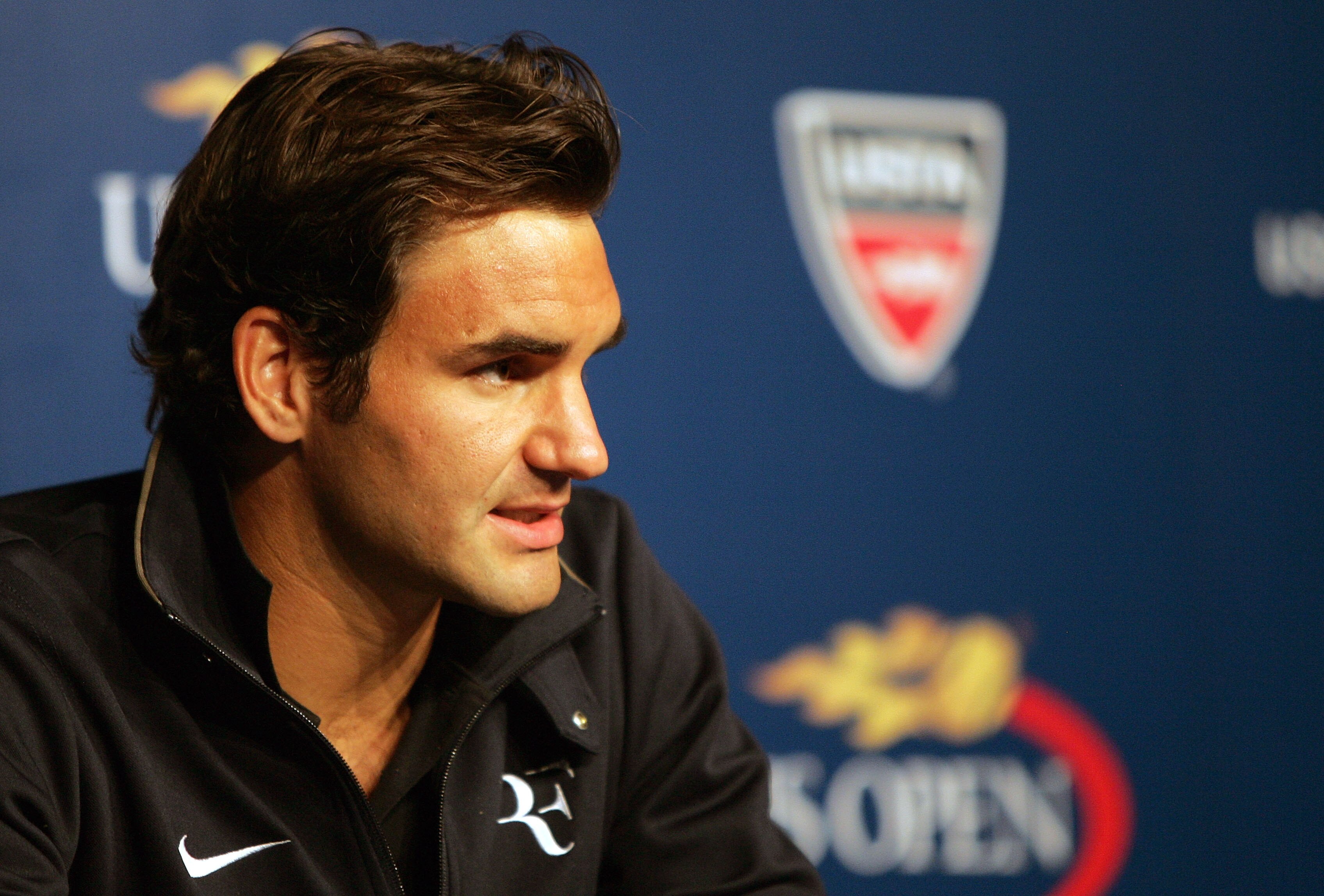 NEW YORK - AUGUST 28:  Roger Federer of Switzerland talks to the media during a press conference held on Arthur Ashe Kids' Day prior to the start of the 2010 U.S. Open at the USTA Billie Jean King National Tennis Center on August 28, 2010 in the Flushing 