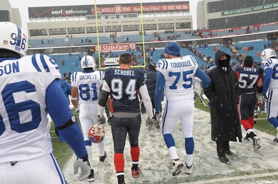 Aaron Schobel walks off as a Bill after his final game in 2009