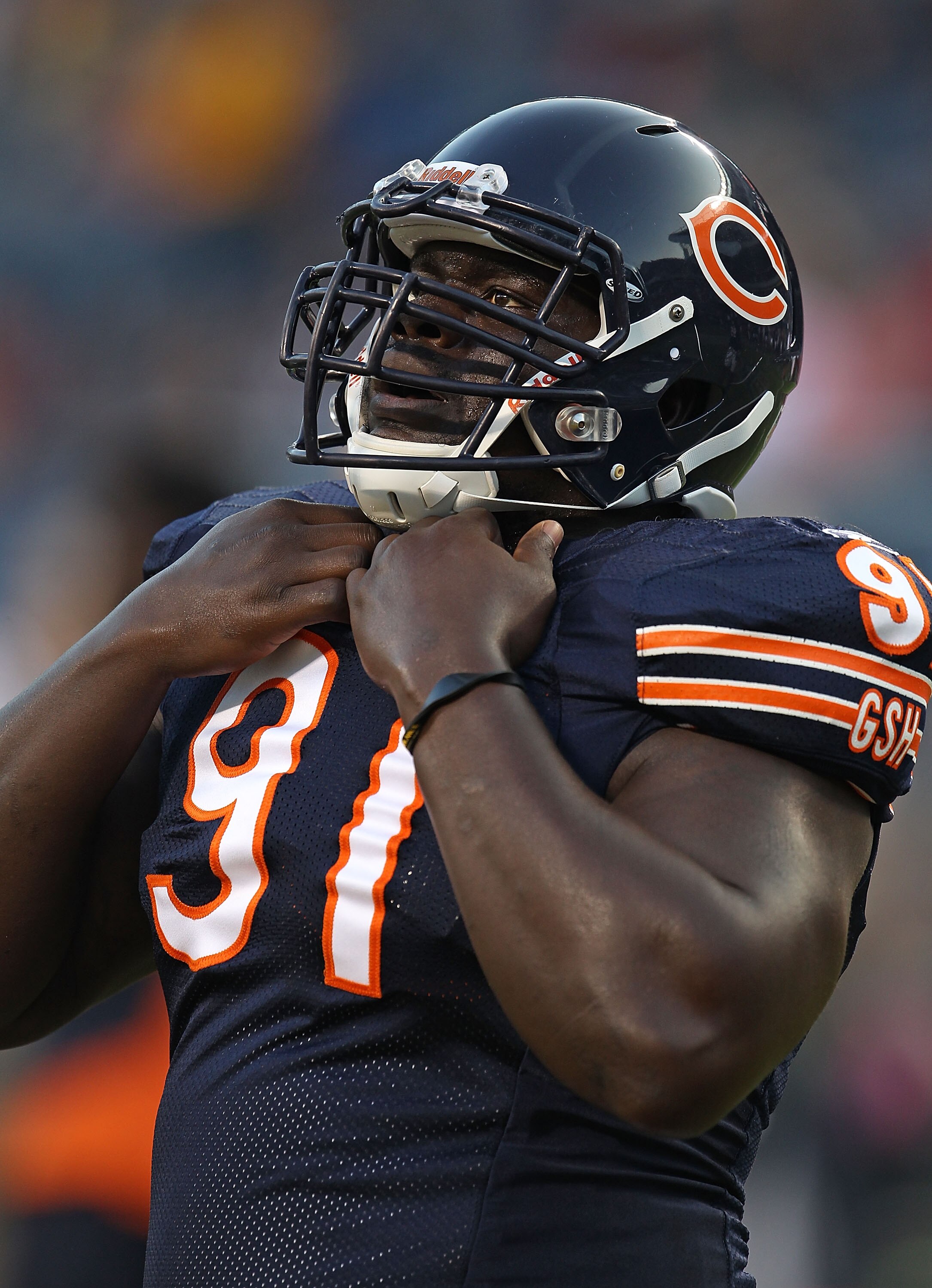CHICAGO - AUGUST 21:  Tommie Harris #91 of the Chicago Bears warms-up before a preseason game against the Oakland Raiders at Soldier Field on August 21, 2010 in Chicago, Illinois. The Raiders defeated the Bears 32-17.  (Photo by Jonathan Daniel/Getty Imag