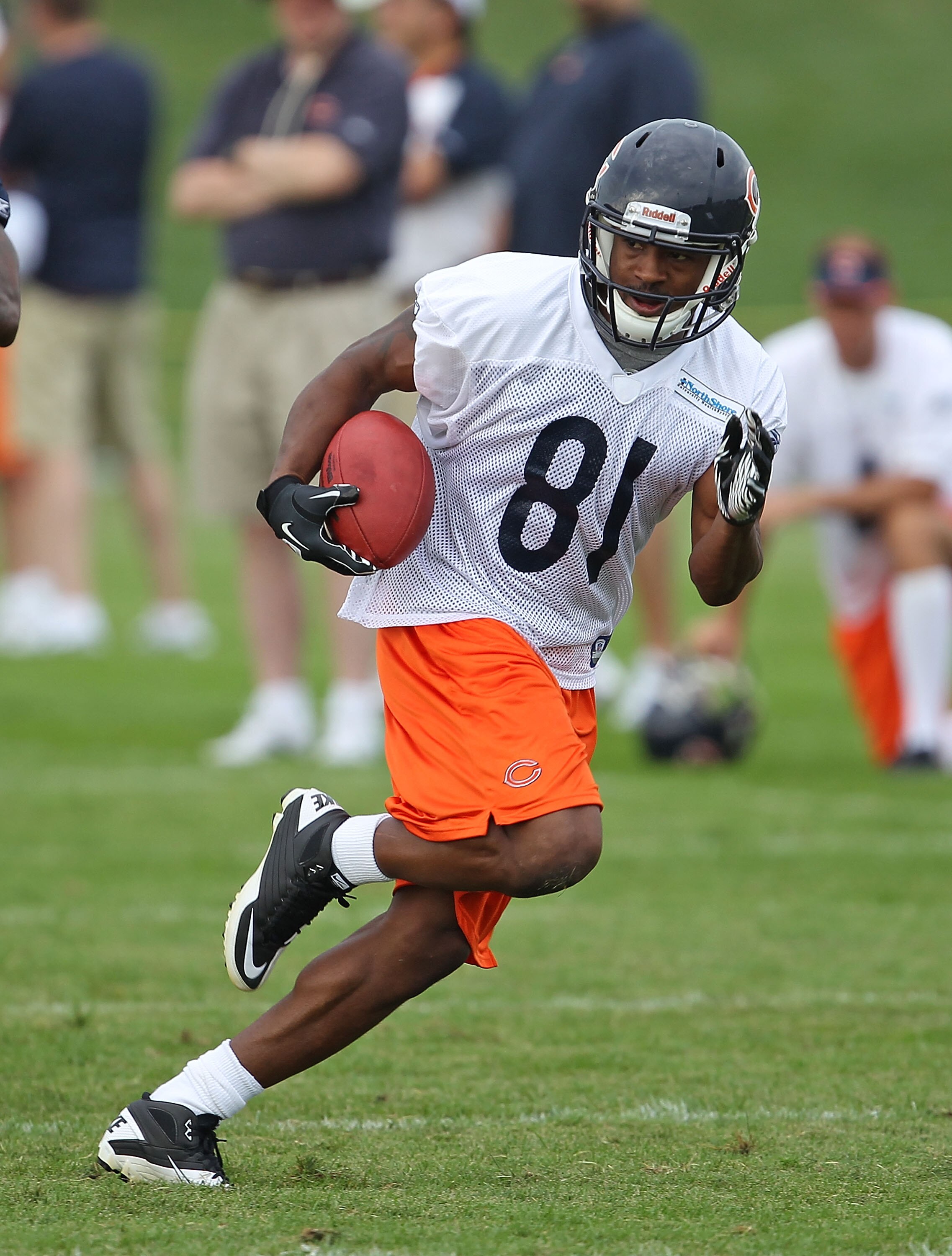 BOURBONNAIS, IL - JULY 30: Rashied Davis #81 of the Chicago Bears runs after catching a pass during a summer training camp practice at Olivet Nazarene University on July 30, 2010 in Bourbonnais, Illinois.  (Photo by Jonathan Daniel/Getty Images)