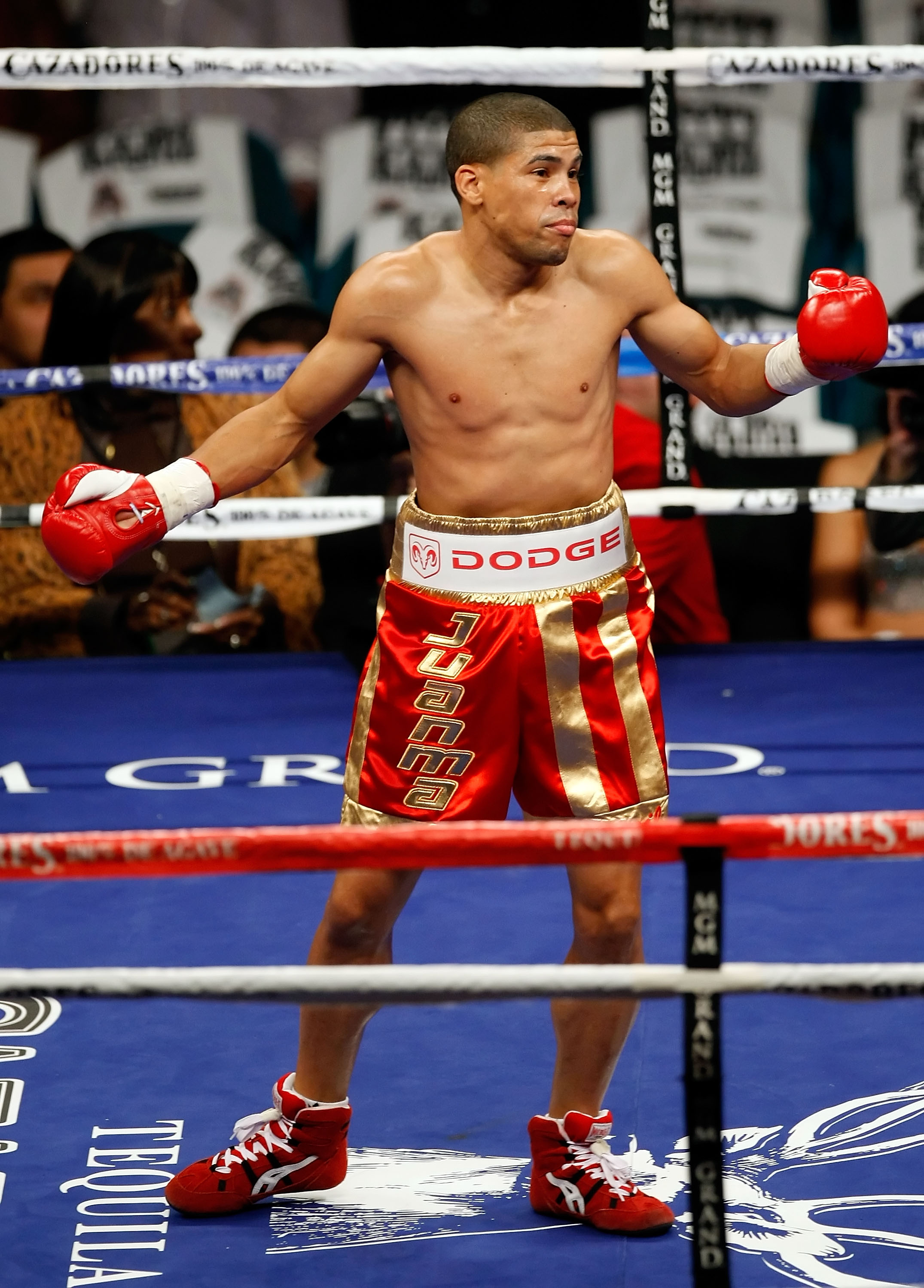 LAS VEGAS - DECEMBER 06: (L-R) Juan Manuel Lopez of Puerto Rico reacts after knocking out Sergio Medina of Argentina during their WBO junior featherweight title fight at the MGM Grand Garden Arena December 6, 2008 in Las Vegas, Nevada. (Photo by Ethan M LAS VEGAS - DECEMBER 06: (L-R) Juan Manuel Lopez of Puerto Rico reacts after knocking out Sergio Medina of Argentina during their WBO junior featherweight title fight at the MGM Grand Garden Arena December 6, 2008 in Las Vegas, Nevada. (Photo by Ethan M