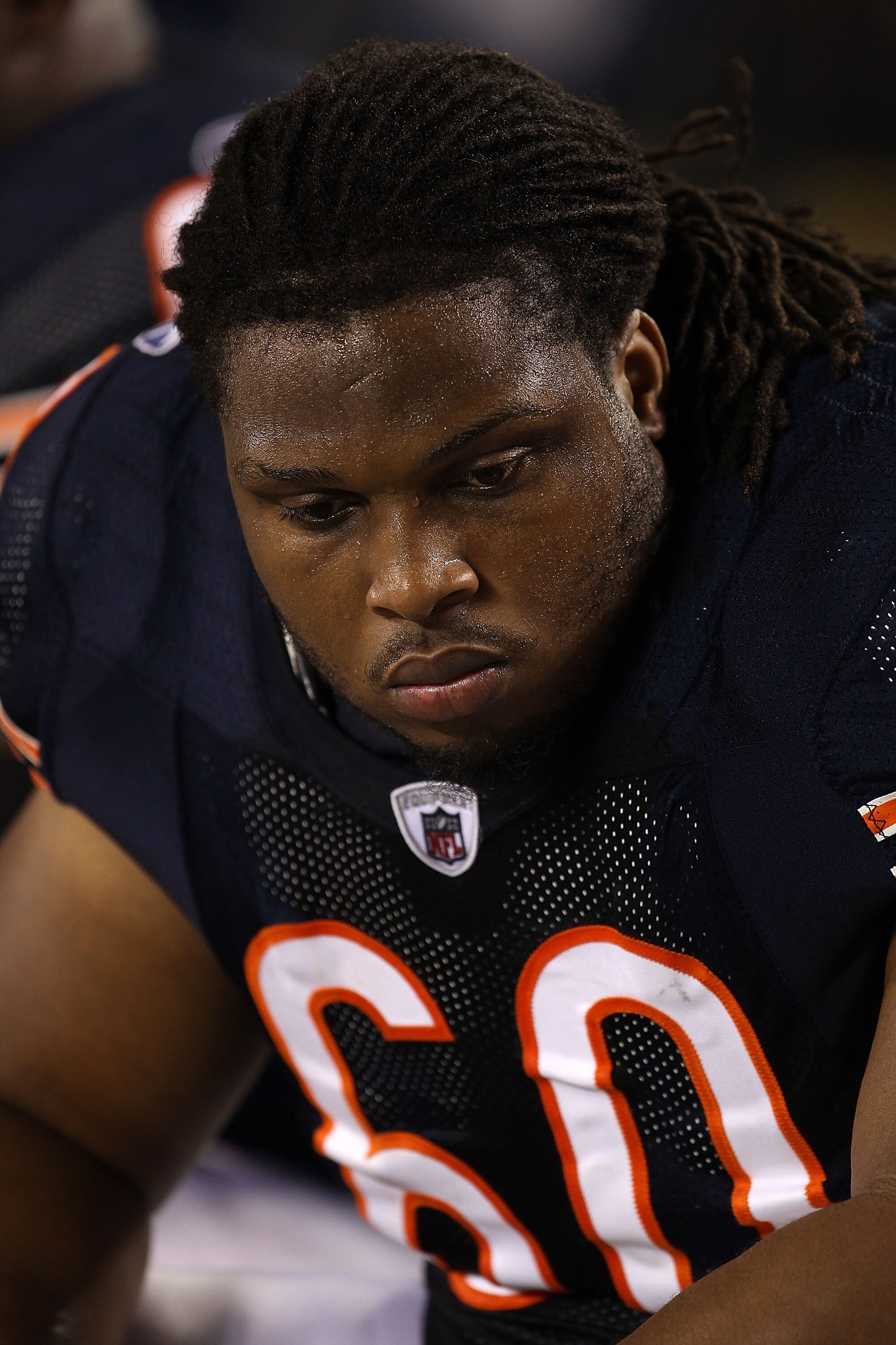 CHICAGO - AUGUST 21: Lance Louis #60 of the Chicago Bears sits on the bench during a preseason game against the Oakland Raiders at Soldier Field on August 21, 2010 in Chicago, Illinois. The Raiders defeated the Bears 32-17. (Photo by Jonathan Daniel/Getty
