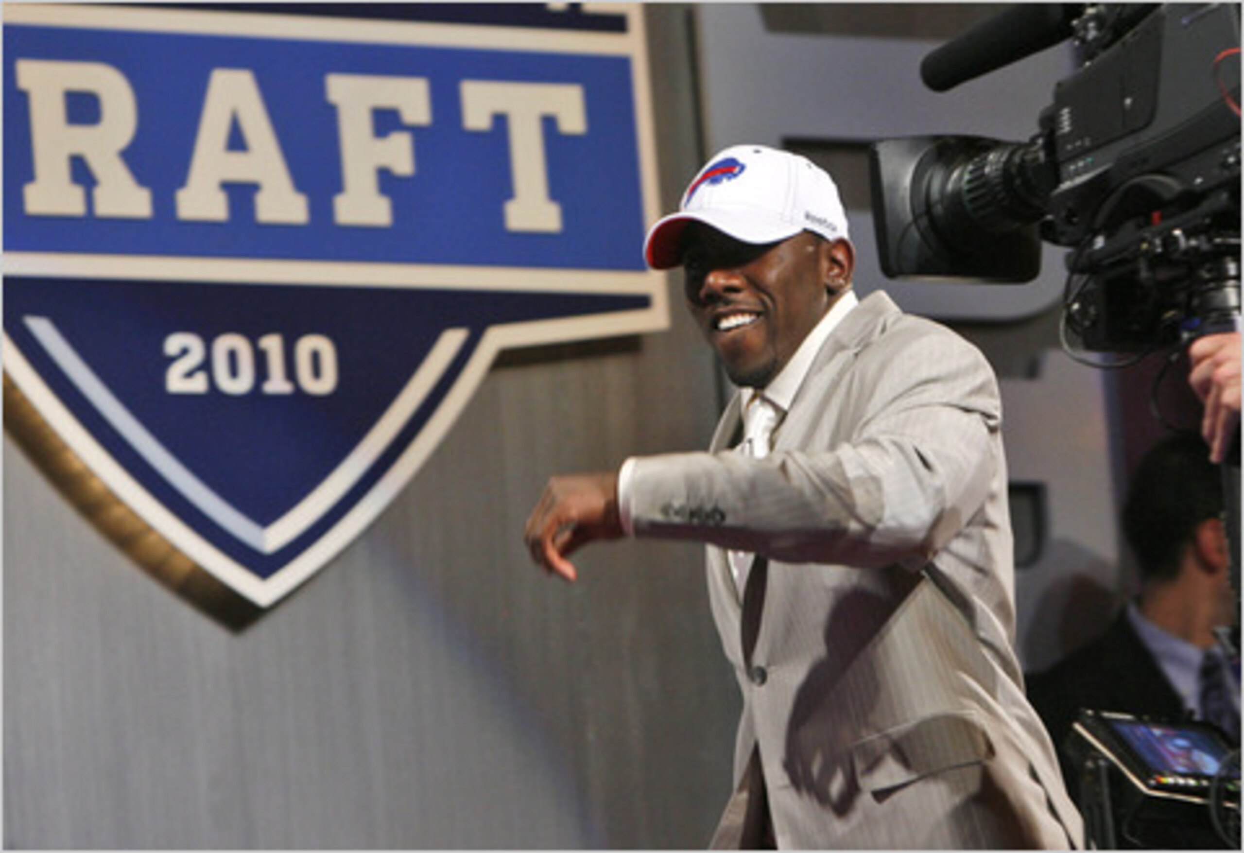 Top 10 pick C.J. Spiller is all smiles at the draft