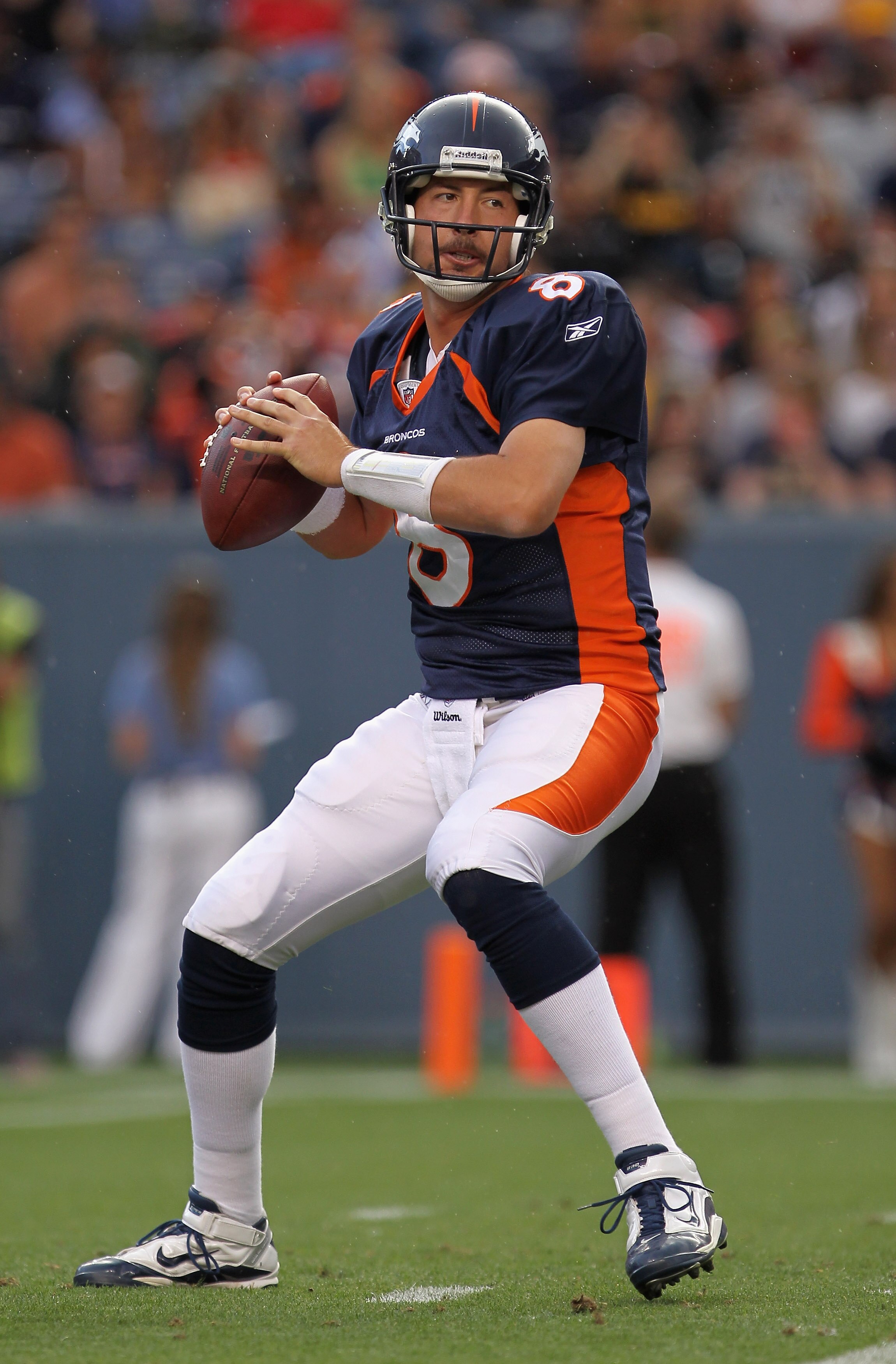 DENVER - AUGUST 29:  Quarterback Kyle Orton #8 of the Denver Broncos drops back to deliver a pass against the Pittsburgh Steelers during preseason NFL action at INVESCO Field at Mile High on August 29, 2010 in Denver, Colorado. The Broncos defeated the St