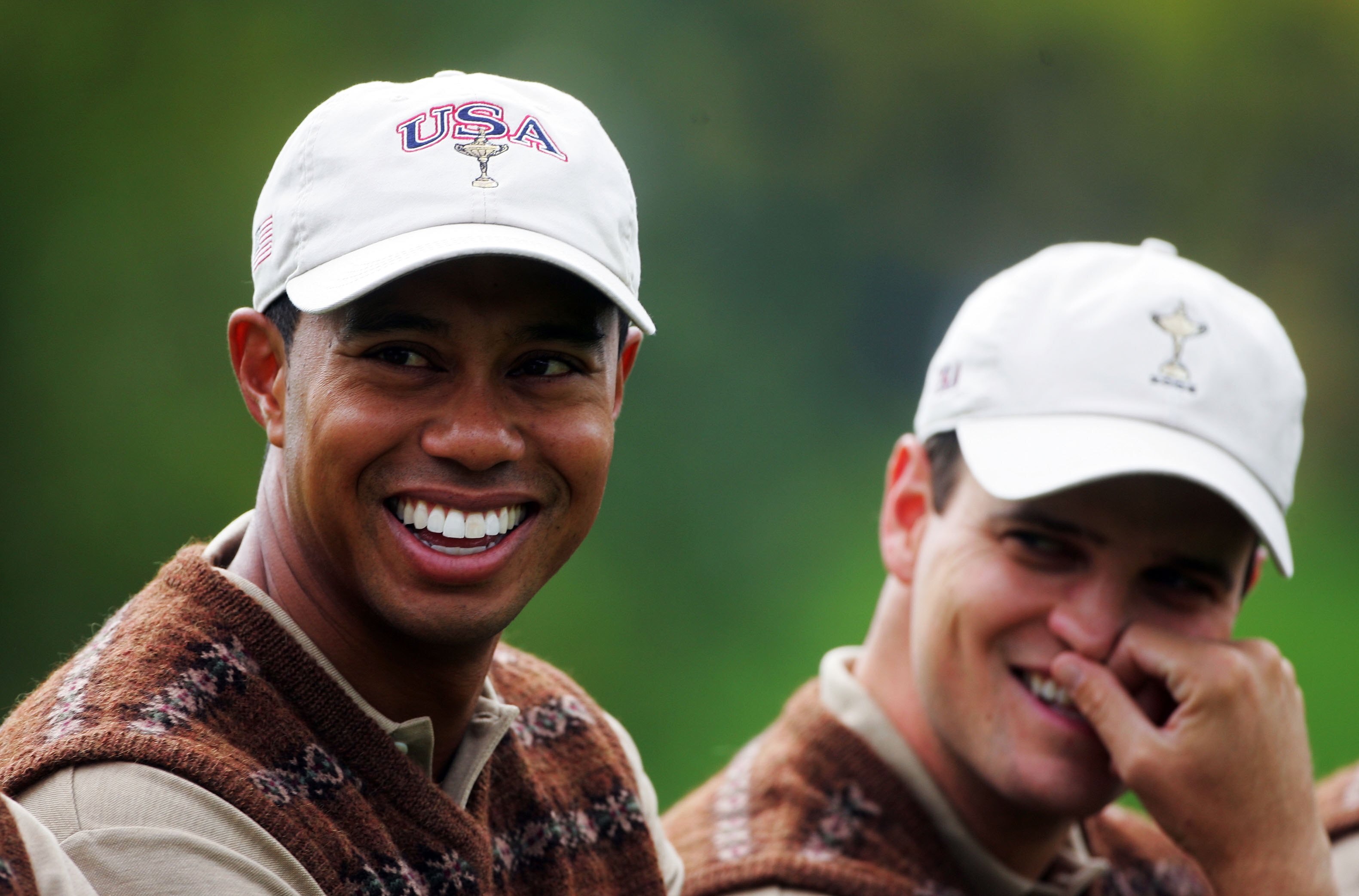 KILDARE, IRELAND - SEPTEMBER 21:  Tiger Woods of USA smiles as he lines up with his team mates for the official team group photocall during the third official practice day of the 2006 Ryder Cup at The K Club on September 21, 2006 in Straffan, Co. Kildare,
