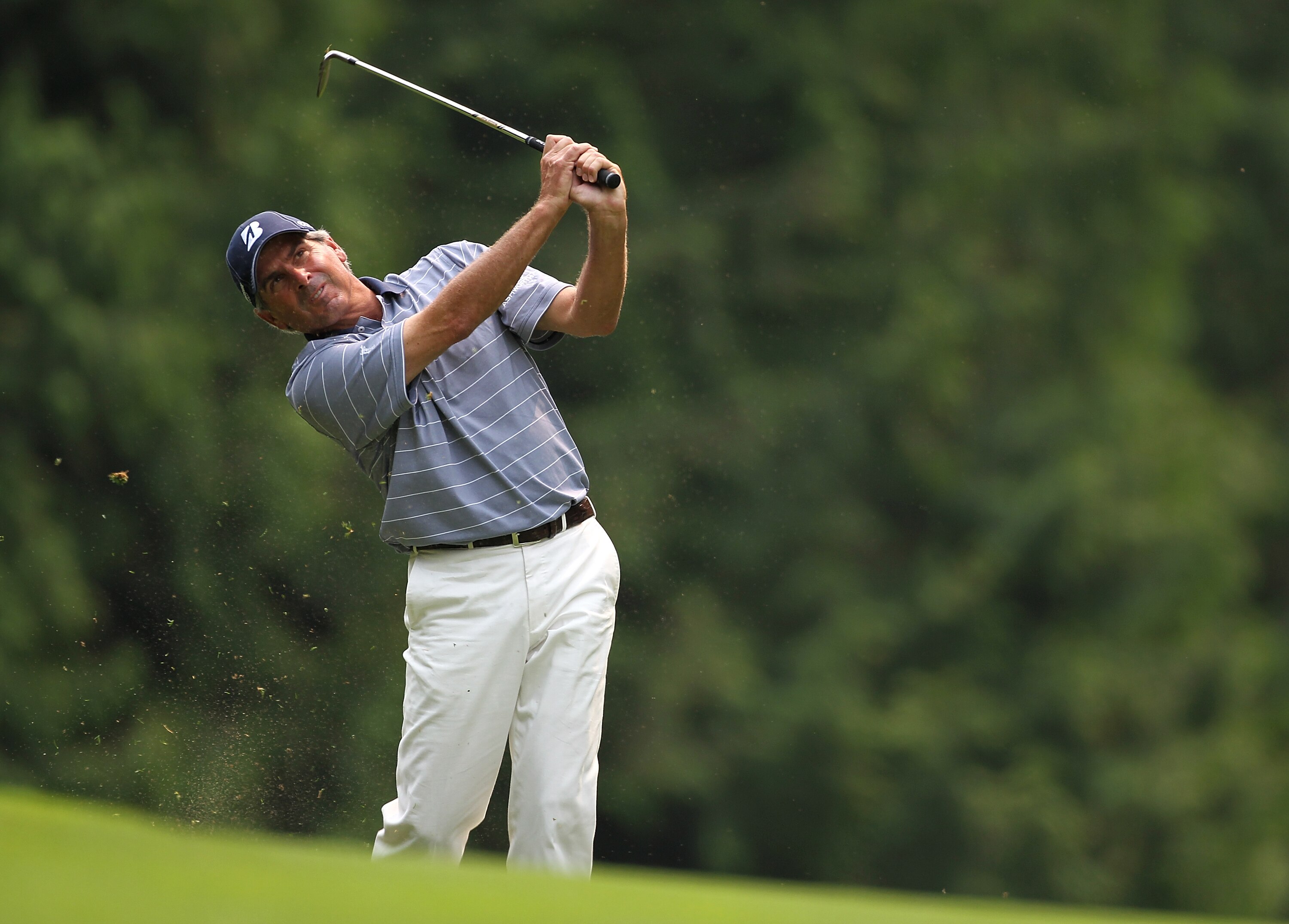 SAMMAMISH, WA - AUGUST 01:  Fred Couples hits his second shot on the 14th hole during the final round of the U.S. Senior Open Championship on August 1, 2010 at Sahalee Country Club in Sammamish, Washington..  (Photo by Jonathan Ferrey/Getty Images)
