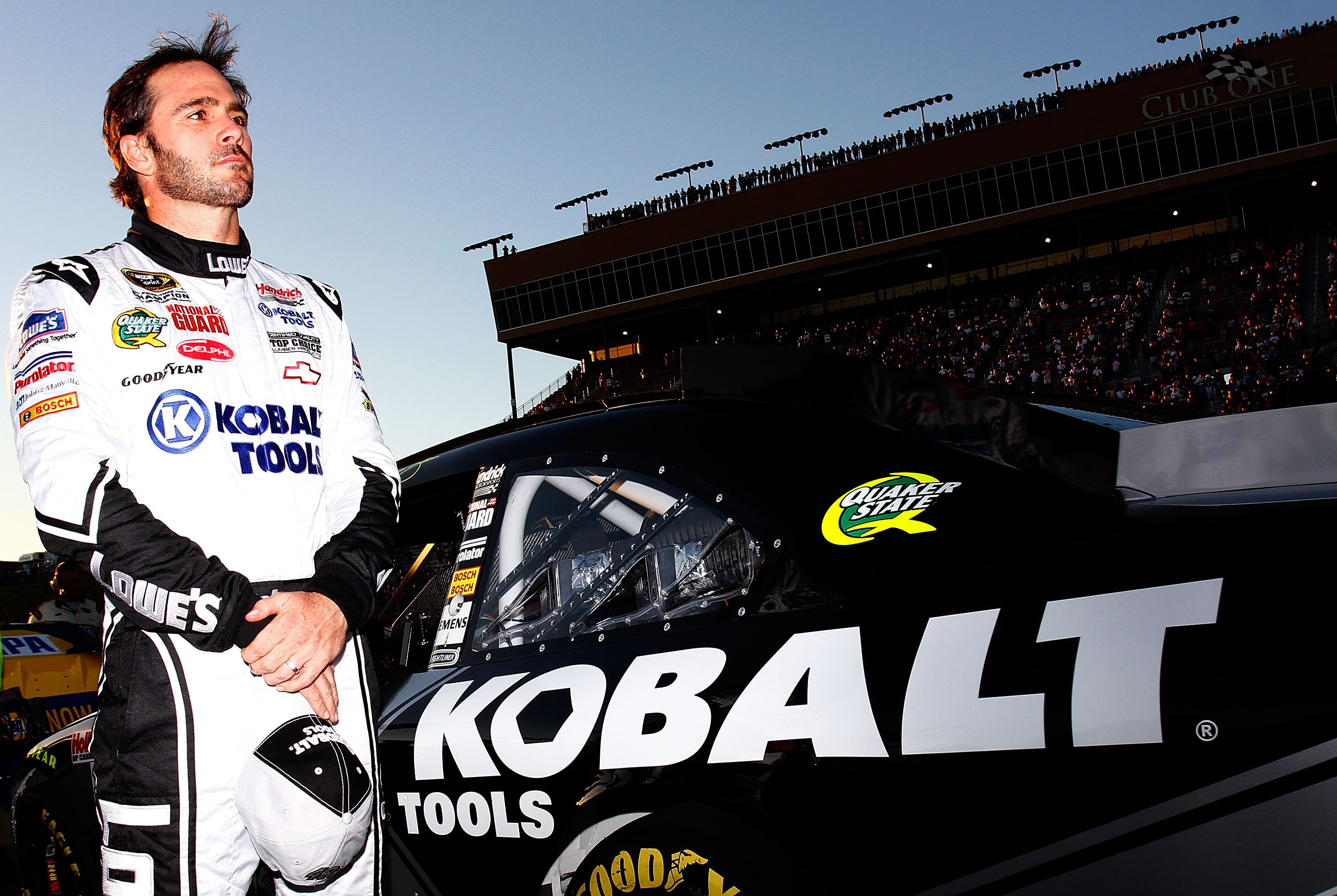 HAMPTON, GA - SEPTEMBER 05:  Jimmie Johnson, driver of the #48 Lowe's/KOBALT Tools Chevrolet, stands on the grid prior to the start of the NASCAR Sprint Cup Series Emory Healthcare 500 at Atlanta Motor Speedway on September 5, 2010 in Hampton, Georgia.  (