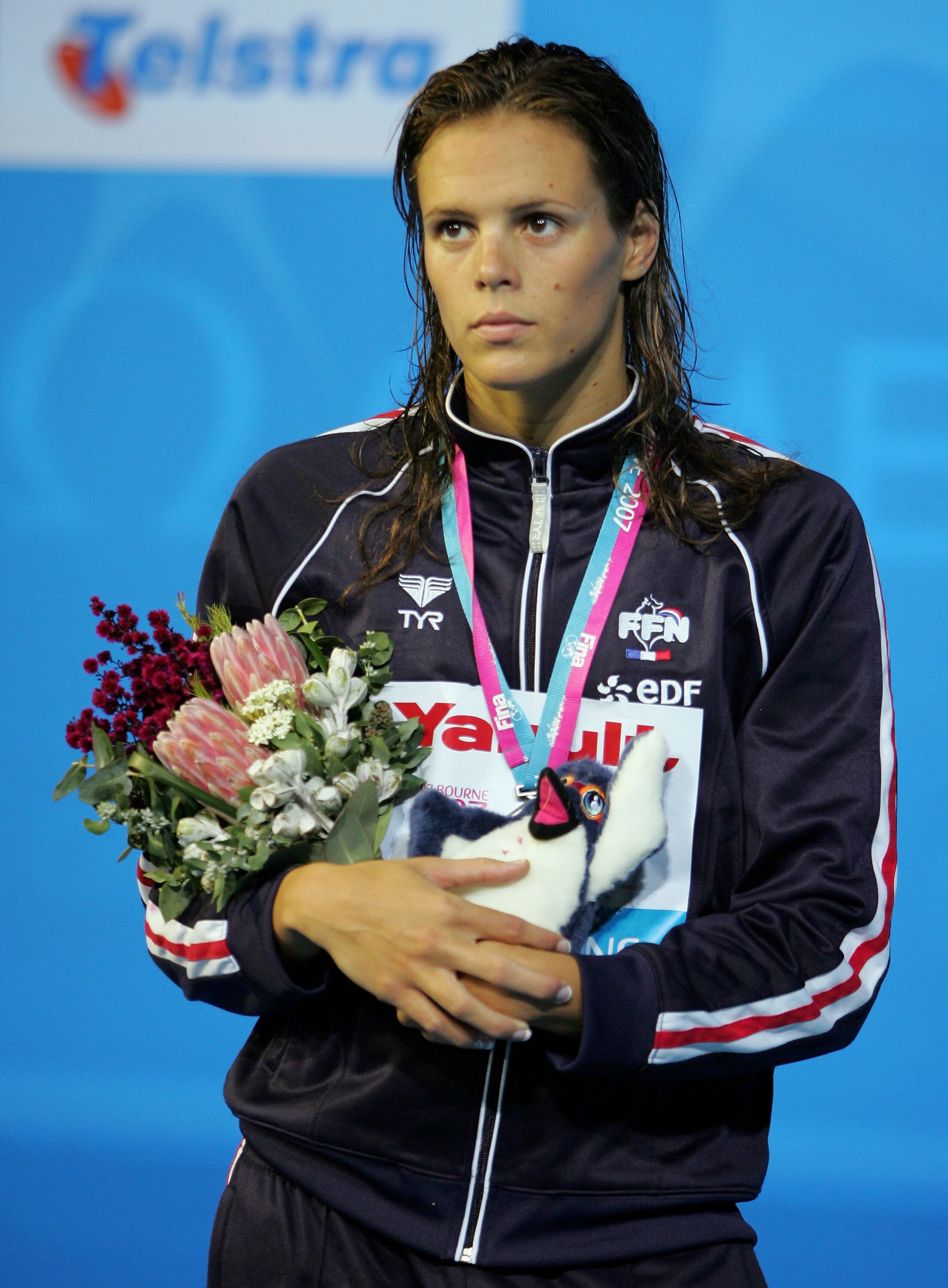 MELBOURNE, AUSTRALIA - MARCH 31:  Laure Manaudou of France stands on the podium after receiving her silver medal in the Women's 800m Freestyle Final during the XII FINA World Championships at the Rod Laver Arena on March 31, 2007 in Melbourne, Australia.