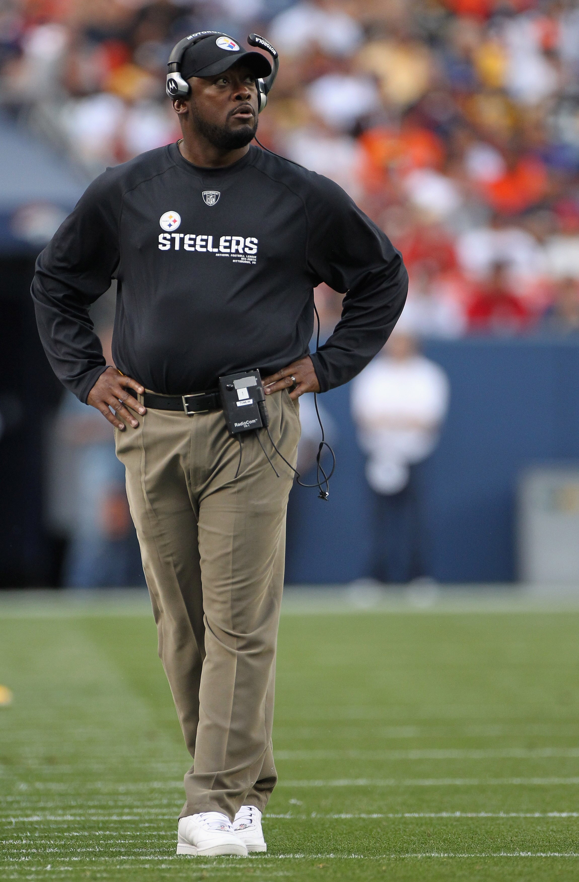 DENVER - AUGUST 29:  Head coach Mike Tomlin of the Pittsburgh Steelers leads his team against the Denver Broncos during preseason NFL action at INVESCO Field at Mile High on August 29, 2010 in Denver, Colorado. The Broncos defeated the Steelers 34-17.  (P