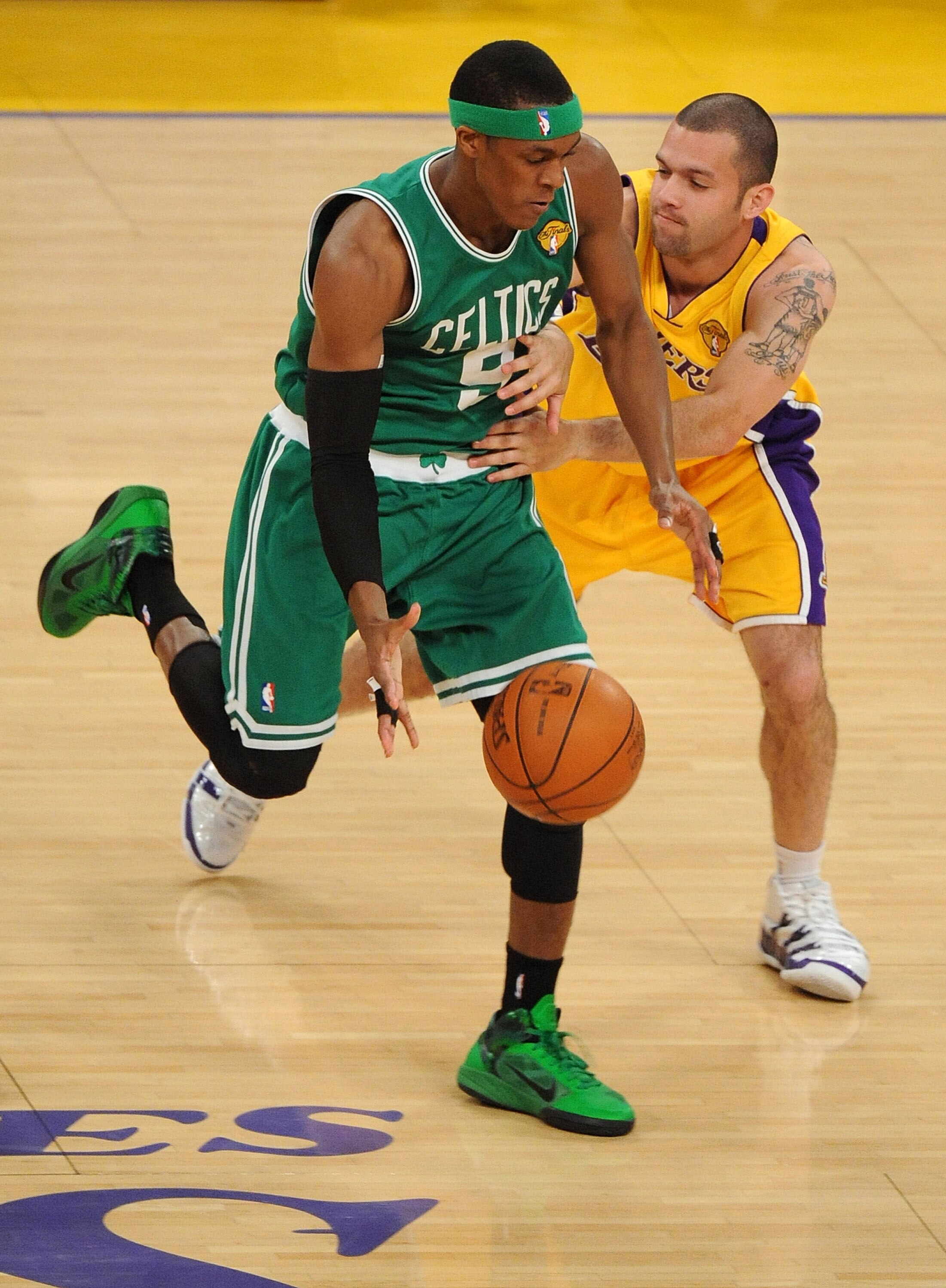 LOS ANGELES, CA - JUNE 17:  Rajon Rondo #9 of the Boston Celtics moves the ball against Jordan Farmar #1 of the Los Angeles Lakers in Game Seven of the 2010 NBA Finals at Staples Center on June 17, 2010 in Los Angeles, California.  NOTE TO USER: User expr