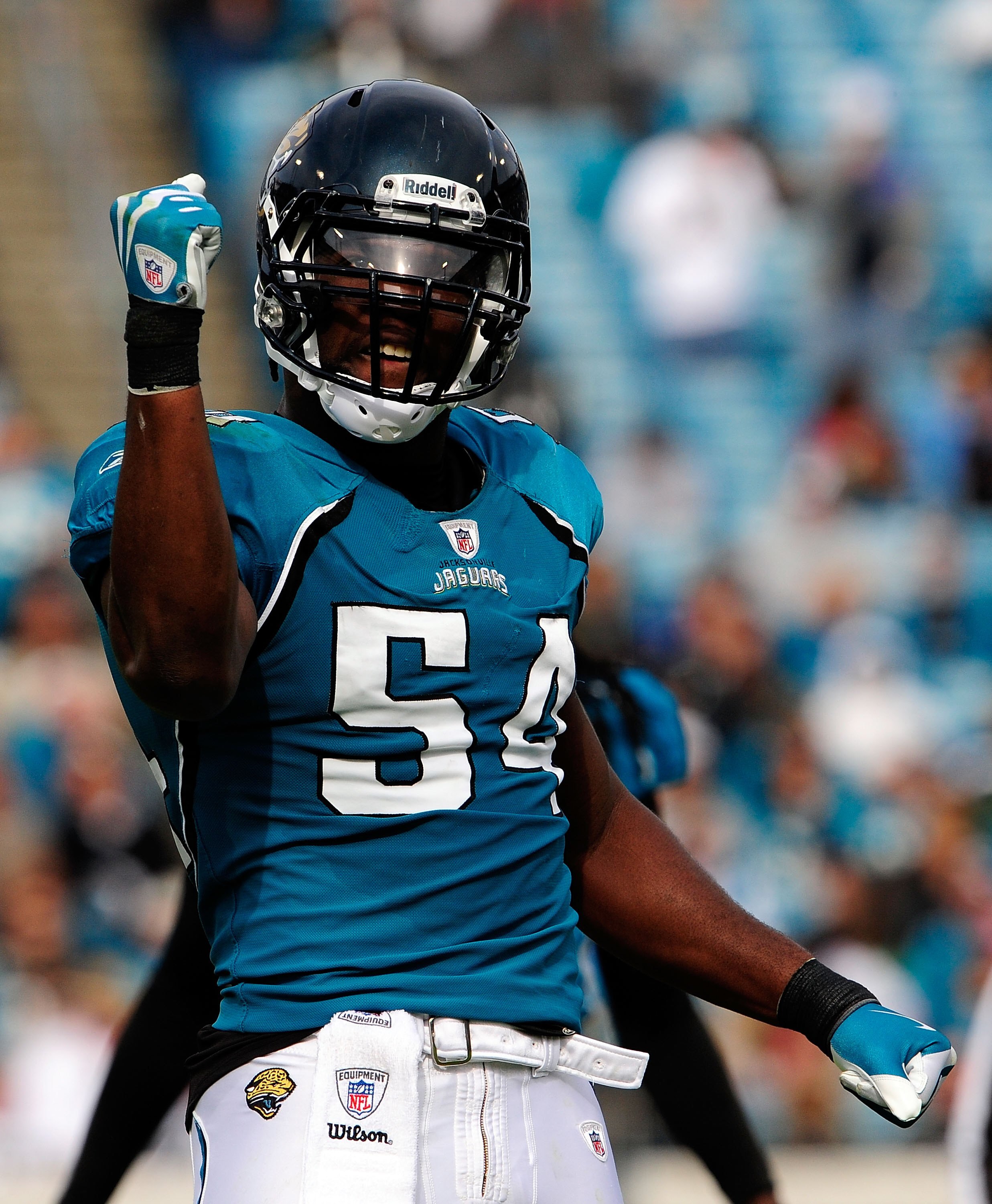 JACKSONVILLE, FL - DECEMBER 06:  Quentin Groves #54 of the Jacksonville Jaguars celebrates after a defensive play during the game against the Houston Texans at Jacksonville Municipal Stadium on December 6, 2009 in Jacksonville, Florida.  (Photo by Sam Gre