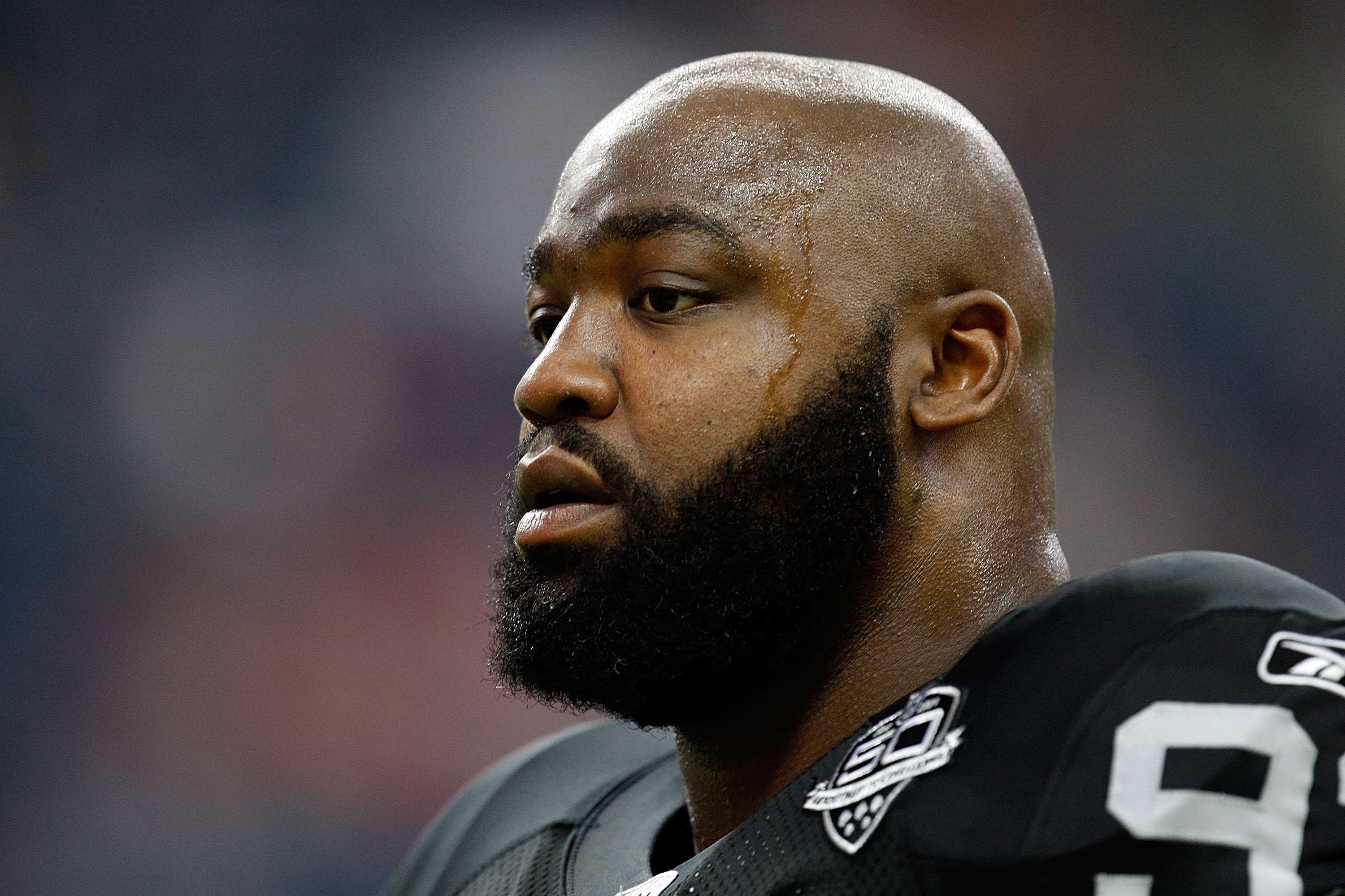 HOUSTON - OCTOBER 04:  Defensive end Tommy Kelly #93 of the Oakland Raiders at Reliant Stadium on October 4, 2009 in Houston, Texas.  (Photo by Ronald Martinez/Getty Images)