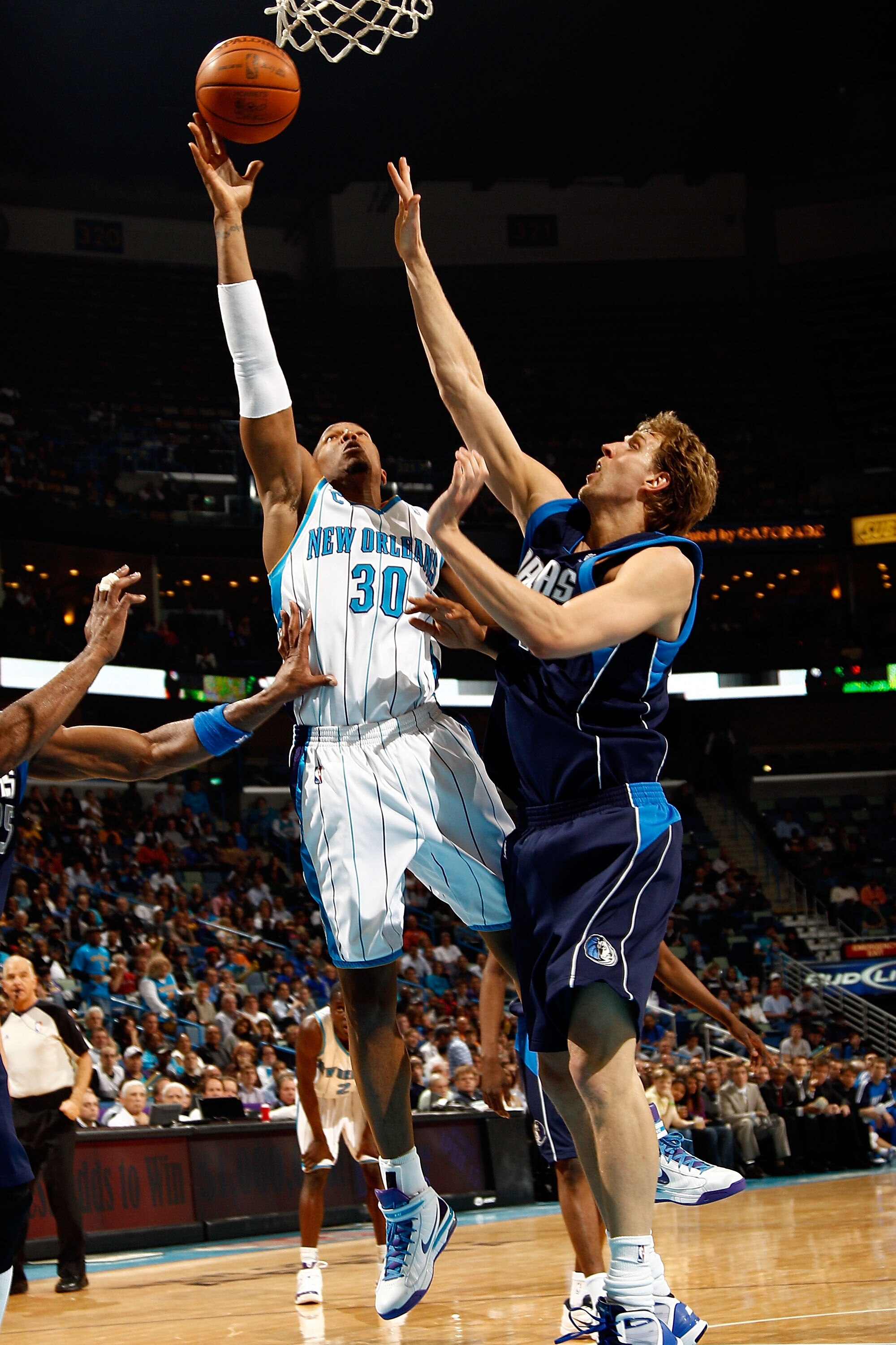 NEW ORLEANS - MARCH 22:  David West #30 of the New Orleans Hornets shoots the ball over Dirk Nowitzki #41 of the Dallas Mavericks at the New Orleans Arena on March 22, 2010 in New Orleans, Louisiana.  NOTE TO USER: User expressly acknowledges and agrees t