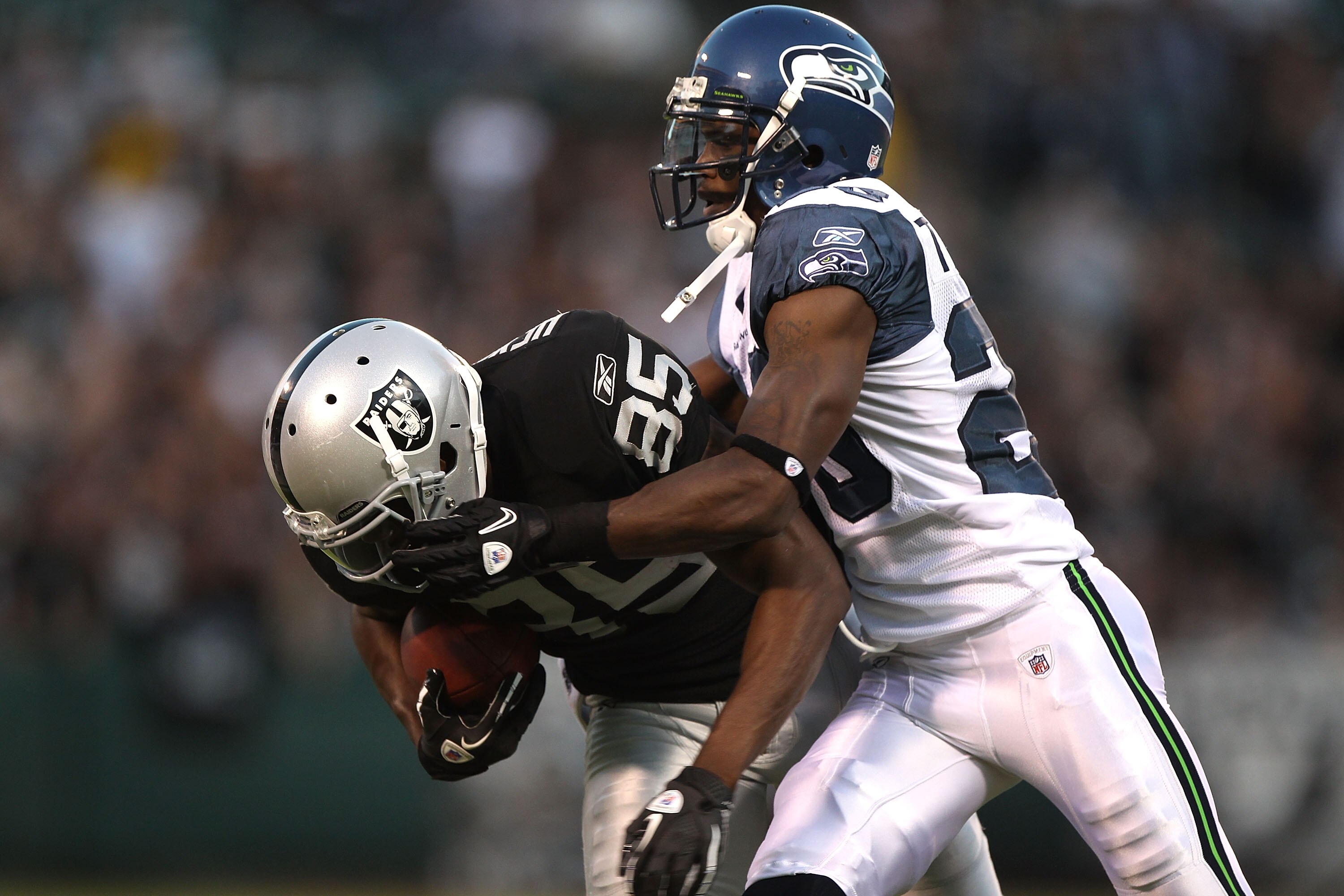 OAKLAND, CA - SEPTEMBER 02:  Darrius Heyward-Bey #85 of the Oakland Raiders catches a pass over Walter Thurmond #28 of the Seattle Seahawks during an NFL preseason game at Oakland-Alameda County Coliseum on September 2, 2010 in Oakland, California.  (Phot