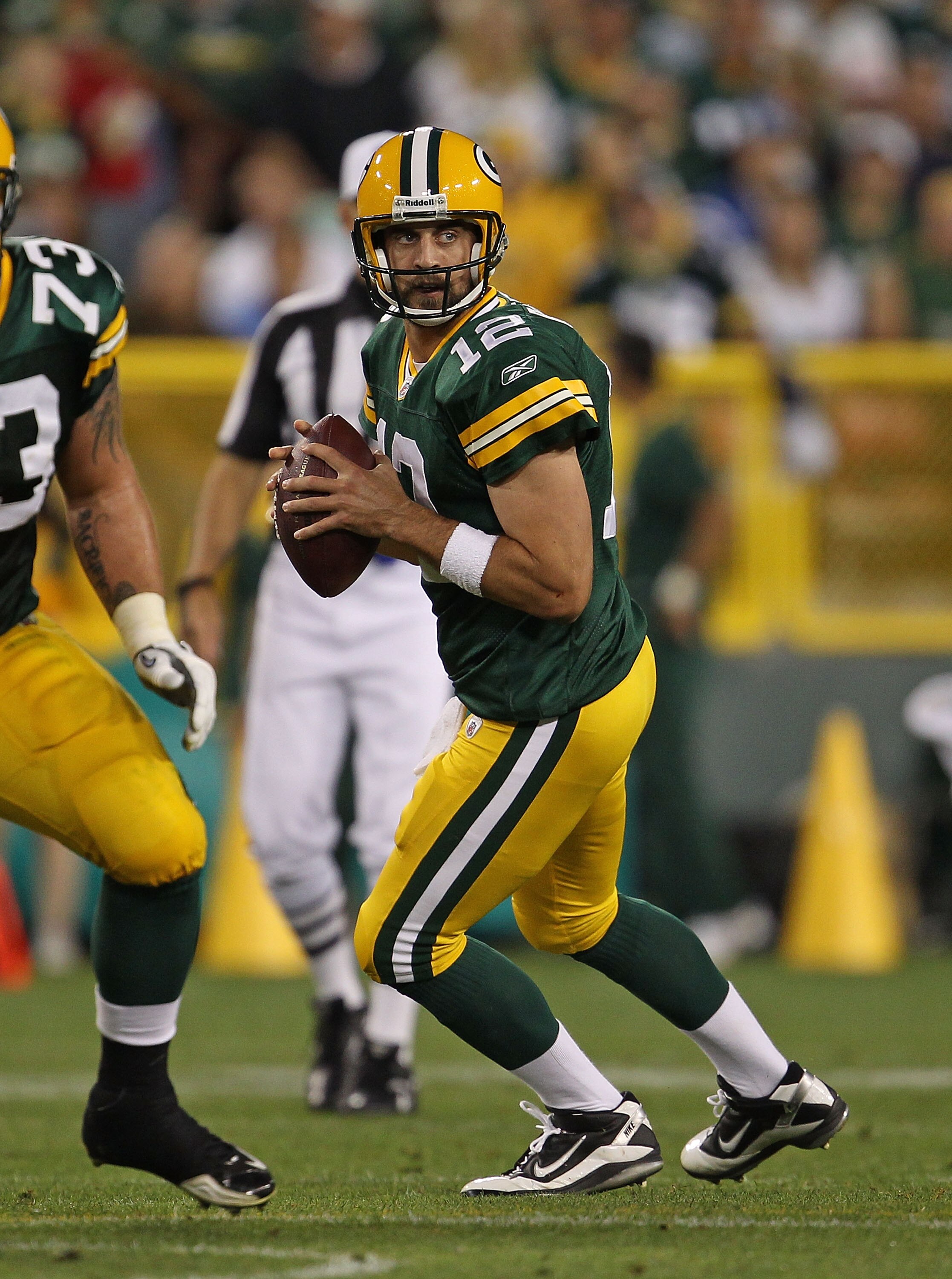 GREEN BAY, WI - AUGUST 26: Aaron Rodgers #12 of the Green Bay Packers looks for a receiver against the Indianapolis Colts during a preseason game at Lambeau Field on August 26, 2010 in Green Bay, Wisconsin. The Packers defeated the Colts 59-24. (Photo by GREEN BAY, WI - AUGUST 26: Aaron Rodgers #12 of the Green Bay Packers looks for a receiver against the Indianapolis Colts during a preseason game at Lambeau Field on August 26, 2010 in Green Bay, Wisconsin. The Packers defeated the Colts 59-24. (Photo by