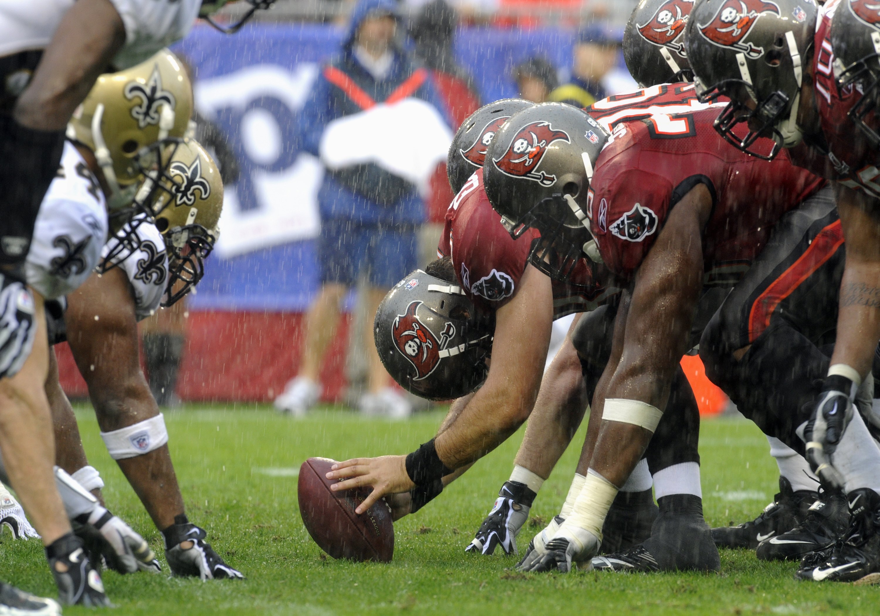 TAMPA, FL - NOVEMBER 30: Long snapper Andrew Economos #48 of the Tampa Bay Buccaneers sets for a snap in the rain against the New Orleans Saints at Raymond James Stadium on November 30, 2008 in Tampa, Florida.  (Photo by Al Messerschmidt/Getty Images)