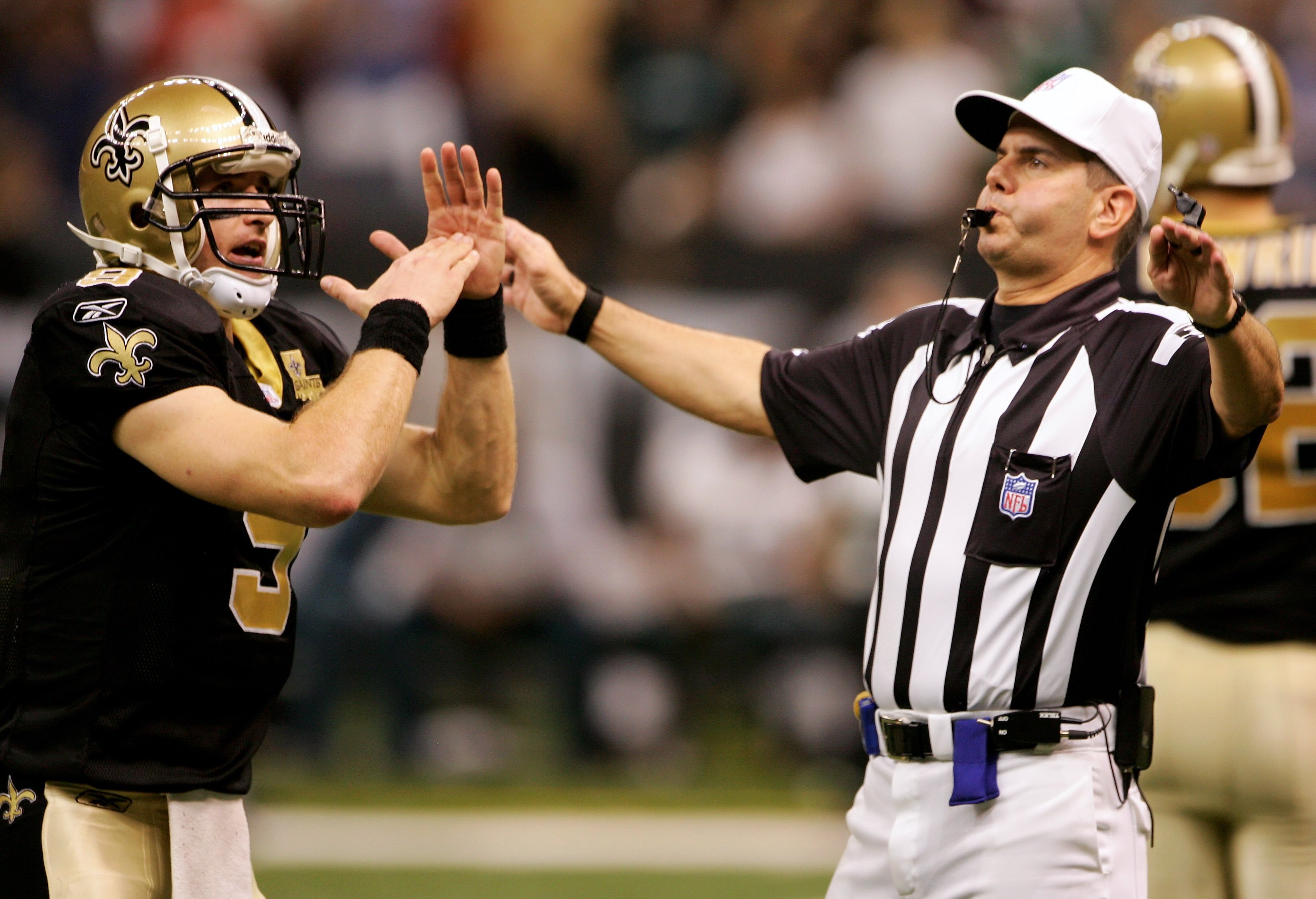 NEW ORLEANS - OCTOBER 15:  Quarterback Drew Brees #9 of the New Orleans Saints calls a time out to referee Billy Vinovich with :03 seconds on the clock before kicker John Carney #3 entered the game to kick the winning 13 yard field goal with no time remai